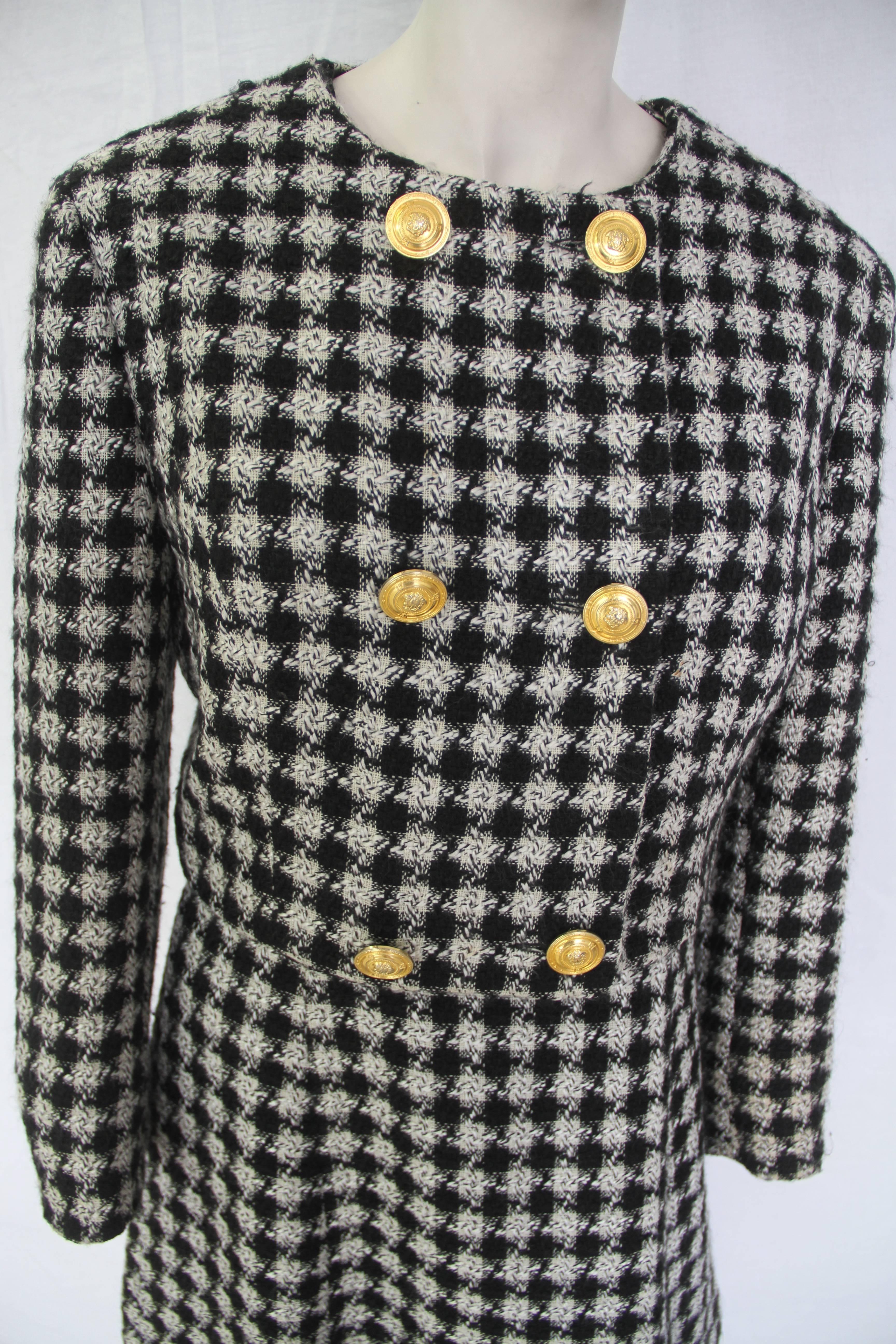Gianni Versace black and white checked sleeveless dress, with matching cropped jacket,from the Fall 1992 Versace Jeans Couture collection.

Marked an Italian size 42.

Manufacturer - Ittierre S.p.a.