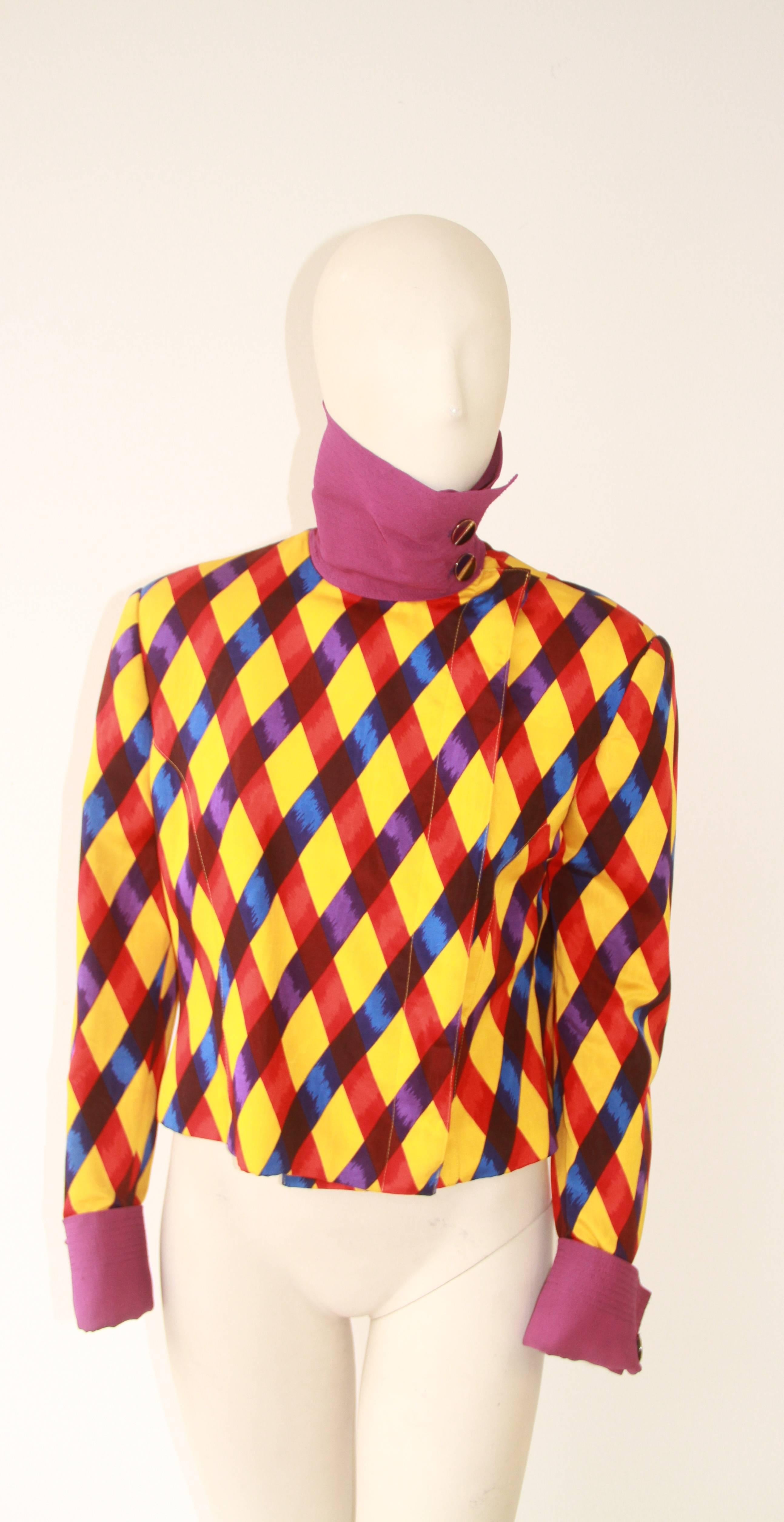 Rare Gianni Versace harlequin printed jacket, with contrast cuffs and collar, from the Spring 1990 collection.

The collar can either be worn folded over, or up as in image 2.

Unmarked, however, sizing is equivalent to an Italian size