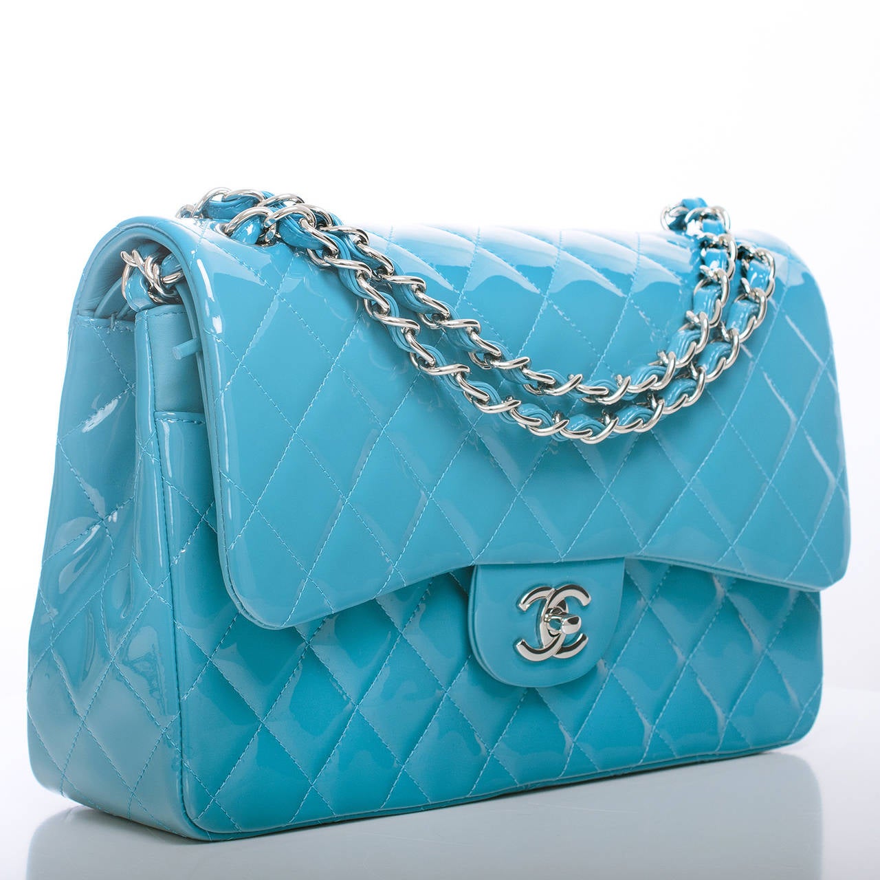 Chanel turquoise blue Jumbo Classic 2.55 double flap bag of quilted patent leather with silver tone hardware.

Named 2.55 to honor the bag's creation in February 1955, the iconic Chanel bag was a modification of the bag Coco Chanel originally