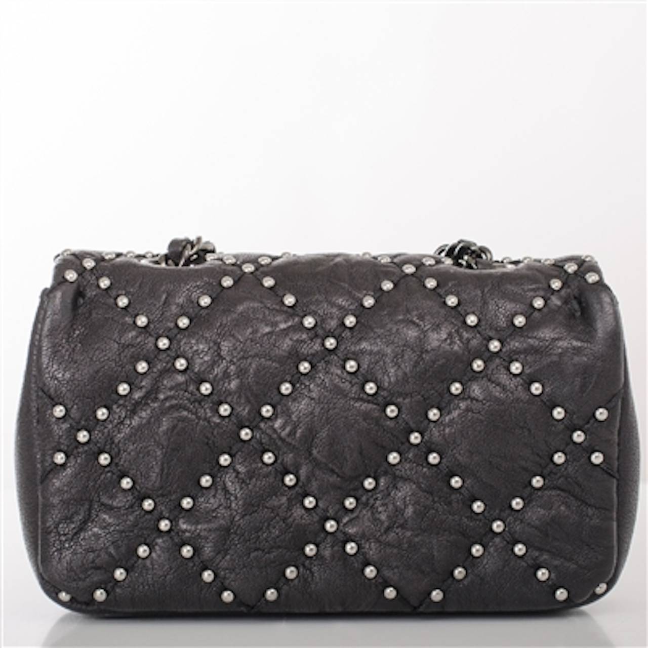 Chanel Black Lambskin Mini Studded Flap Bag In New Condition In New York, NY