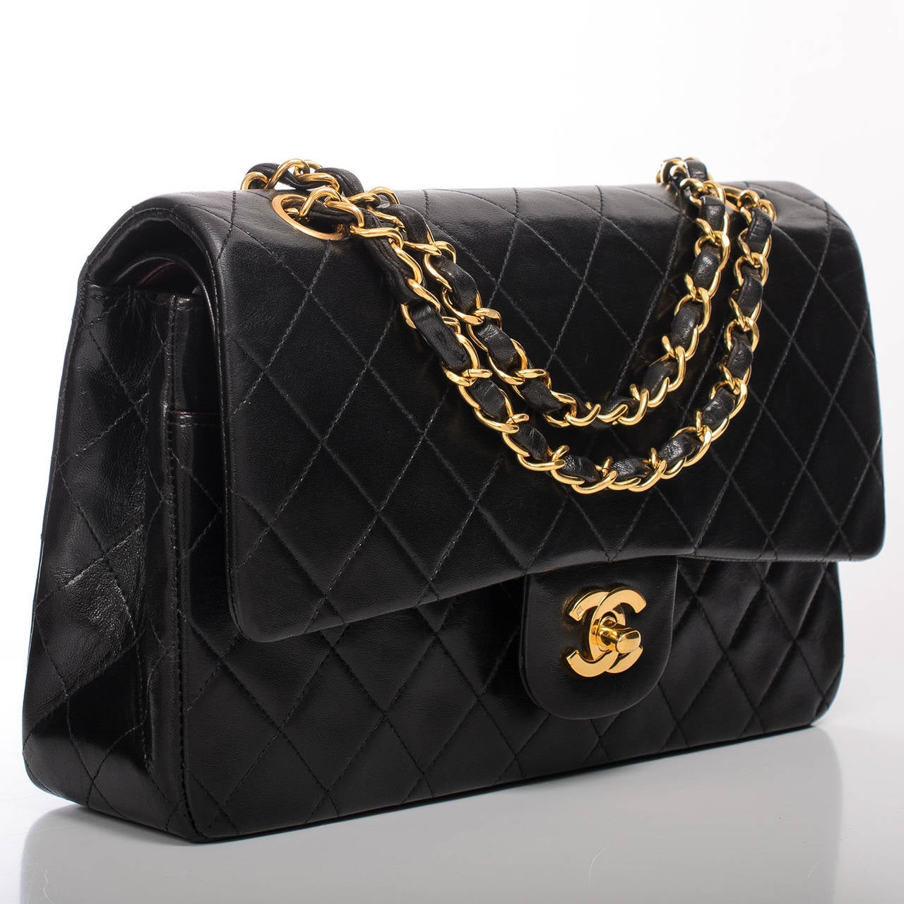 Chanel vintage black Large Classic double flap bag in lambskin leather with gold tone hardware.

This vintage Chanel Large Classic double flap bag proves the timelessness of the Chanel Classic. This bag features all the signature details of a