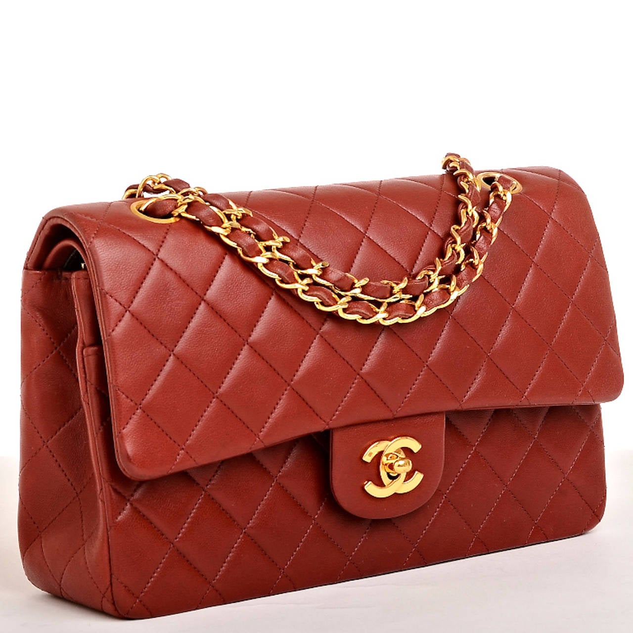Chanel vintage dark red Large Classic double flap bag of quilted lambskin leather with gold tone hardware.

This beautiful vintage Chanel dark red Large Classic double flap bag in rare mint condition proves the timelessness of the Chanel Classic.