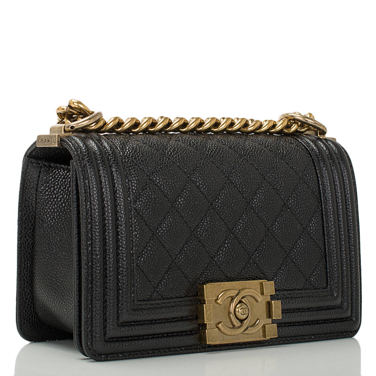 Chanel black Small Boy bag of quilted caviar leather with antiqued gold tone hardware.

The Chanel Boy bag was first introduced in Chanel’s fall/winter 2011 collection and inspired by the spirit of Coco Chanel. Quoting Lagerfeld, 