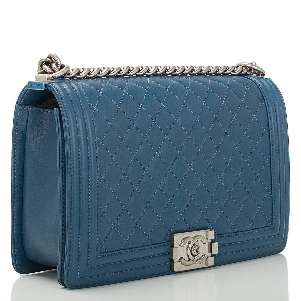 Chanel blue New Medium Boy bag in lambskin leather with aged ruthenium hardware.

The Chanel Boy bag was first introduced in Chanel’s fall/winter 2011 collection and inspired by the spirit of Coco Chanel. Quoting Lagerfeld, 