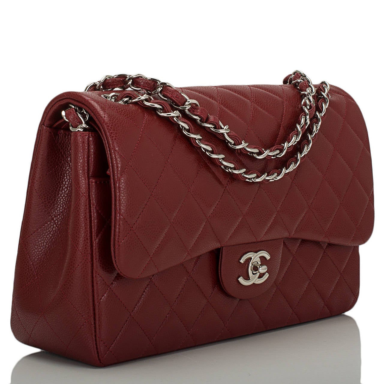 Chanel maroon red Jumbo Classic double flap bag of quilted caviar with silver tone hardware.

This Jumbo Classic double flap is striking in a rich deep maroon red caviar. It features a front flap with signature CC turnlock closure, half moon back