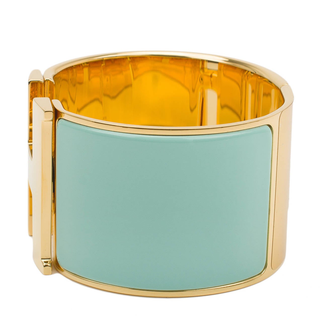 Hermes extra wide Clic Clac H bracelet in Lagoon (pastel bluish-green) enamel with gold plated hardware in size PM.

Condition: Pristine; store fresh condition

Accompanied by: Hermes box, dustbag and carebook

Measurements: Diameter: 2.25