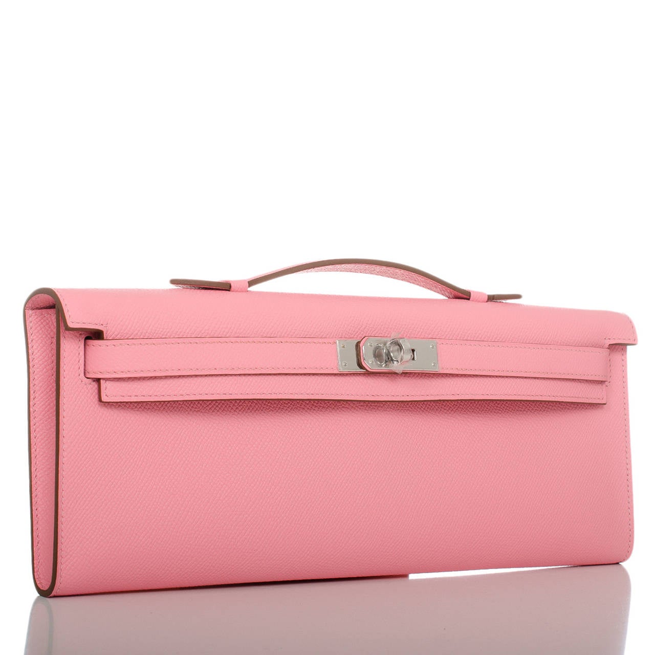 This Kelly Cut in a Hermes' favorite color -- Rose Confetti -- is a gorgeous light pink in epsom leather that is elegant with palladium hardware; the bag has tonal stitching, front straps with toggle closure and a top flat handle.

The interior is