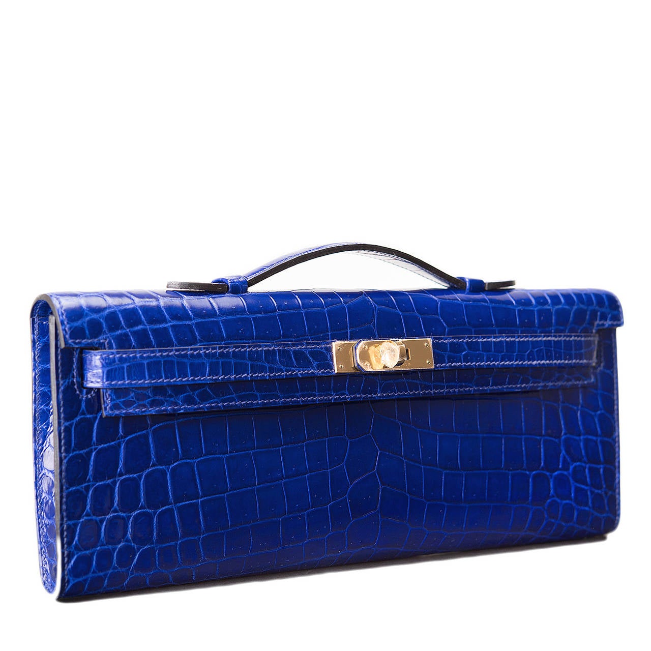 This exotic Kelly Cut of Blue Electric shiny Niloticus crocodile is a gorgeous treasure, paired with complimenting gold hardware; the bag has tonal stitching, front straps with toggle closure and a top flat handle.

The interior is lined in Blue