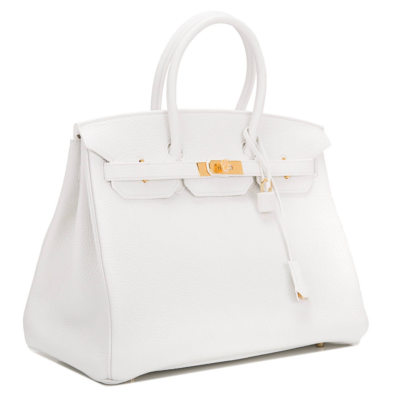 Hermes white Birkin 35cm in taurillon clemence (baby bull) leather with gold hardware.

This white Birkin features tonal stitching, front toggle closure, clochette with lock and two keys, and double rolled handles. The interior is lined in white