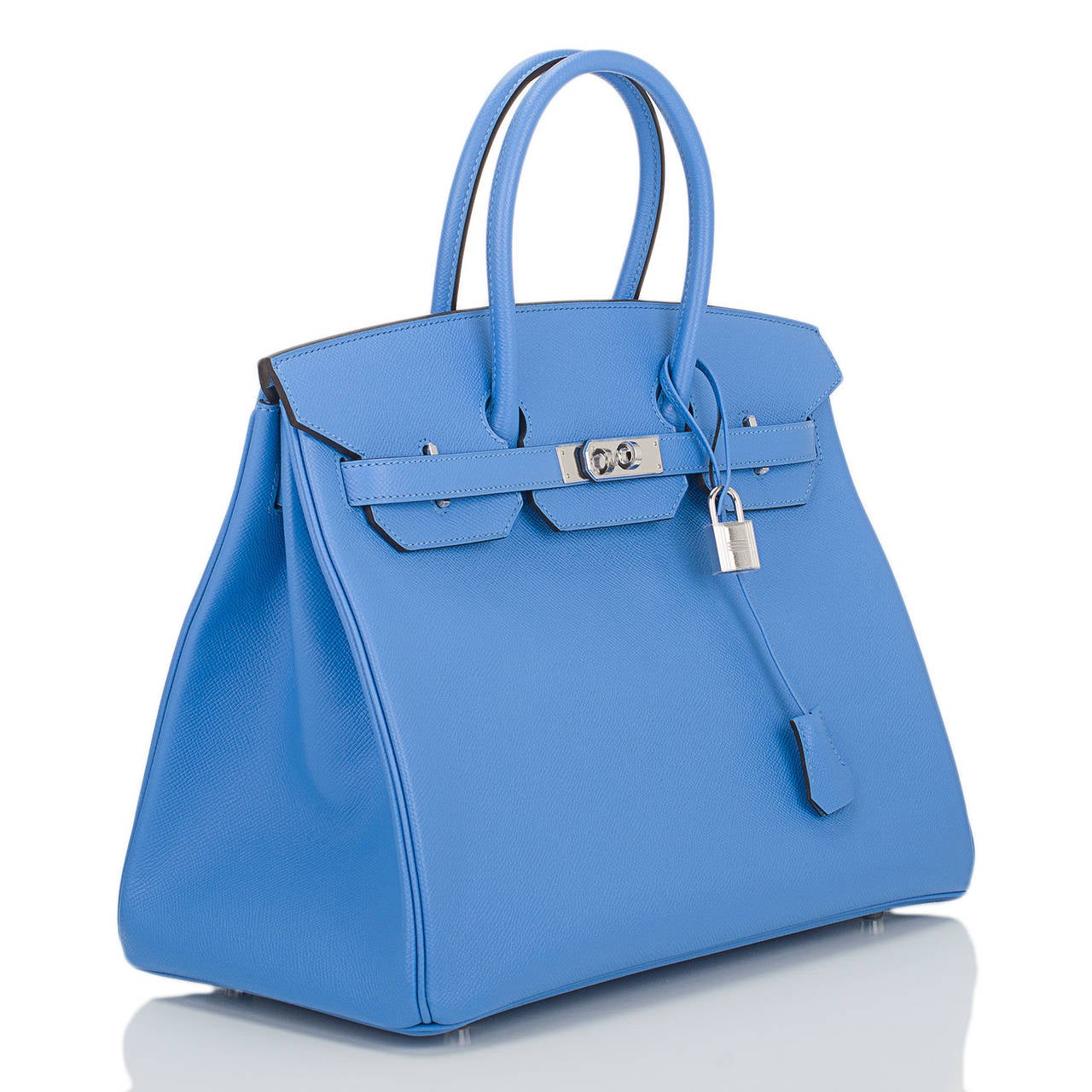 Hermes Blue Paradise Birkin 35cm in epsom leather with palladium hardware.

This Birkin features tonal stitching, front toggle closure, clochette with lock and two keys, and double rolled handles. The interior is lined in Blue Paradise chevre with