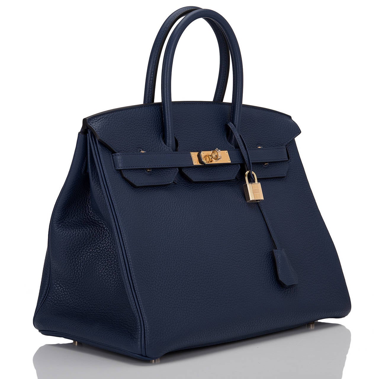 Hermes Blue Sapphire Birkin 35cm in clemence leather with gold hardware

This Birkin features tonal stitching, front toggle closure, clochette with lock and two keys, and double rolled handles. The interior is lined in Blue Sapphire chevre with