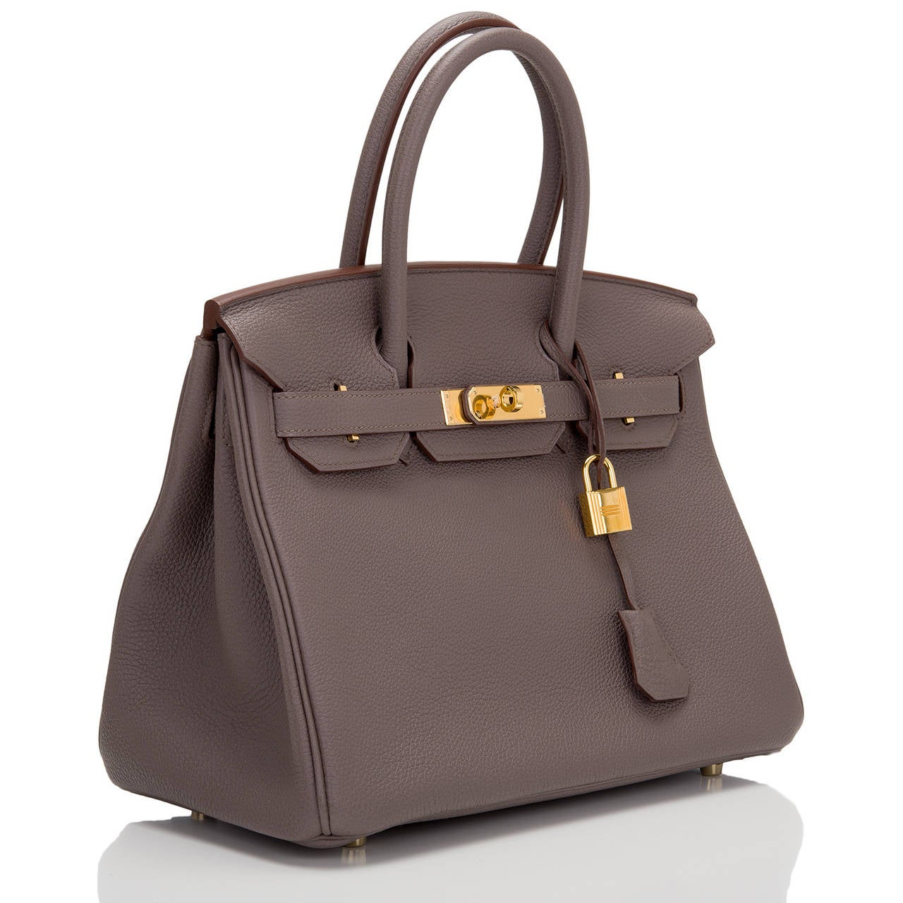 Hermes Etain 30cm in togo (bull) leather with gold hardware.

This Birkin features tonal stitching, front toggle closure, clochette with lock and two keys, and double rolled handles. The interior is lined in Etain chevre with one zip pocket with