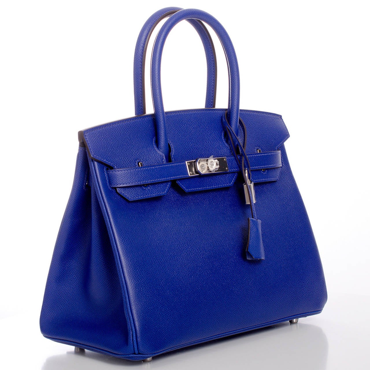 Hermes Blue Electric epsom leather Birkin 30cm with palladium hardware.

The Hermes Birkin is the most coveted and the hardest to secure handbag in the world. Immediately recognizable by its shape, its thin straps with metal plates on the end of