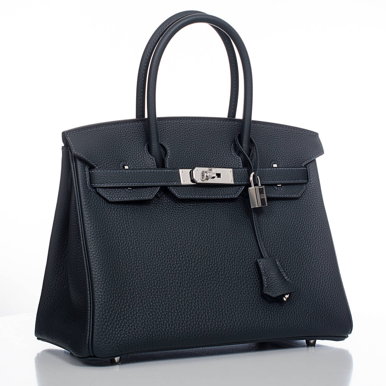 Hermes Blue Ocean Birkin 30cm in togo (bull) leather with palladium hardware.

The Hermes Birkin is the most coveted and the hardest to secure handbag in the world. Immediately recognizable by its shape, its thin straps with metal plates on the