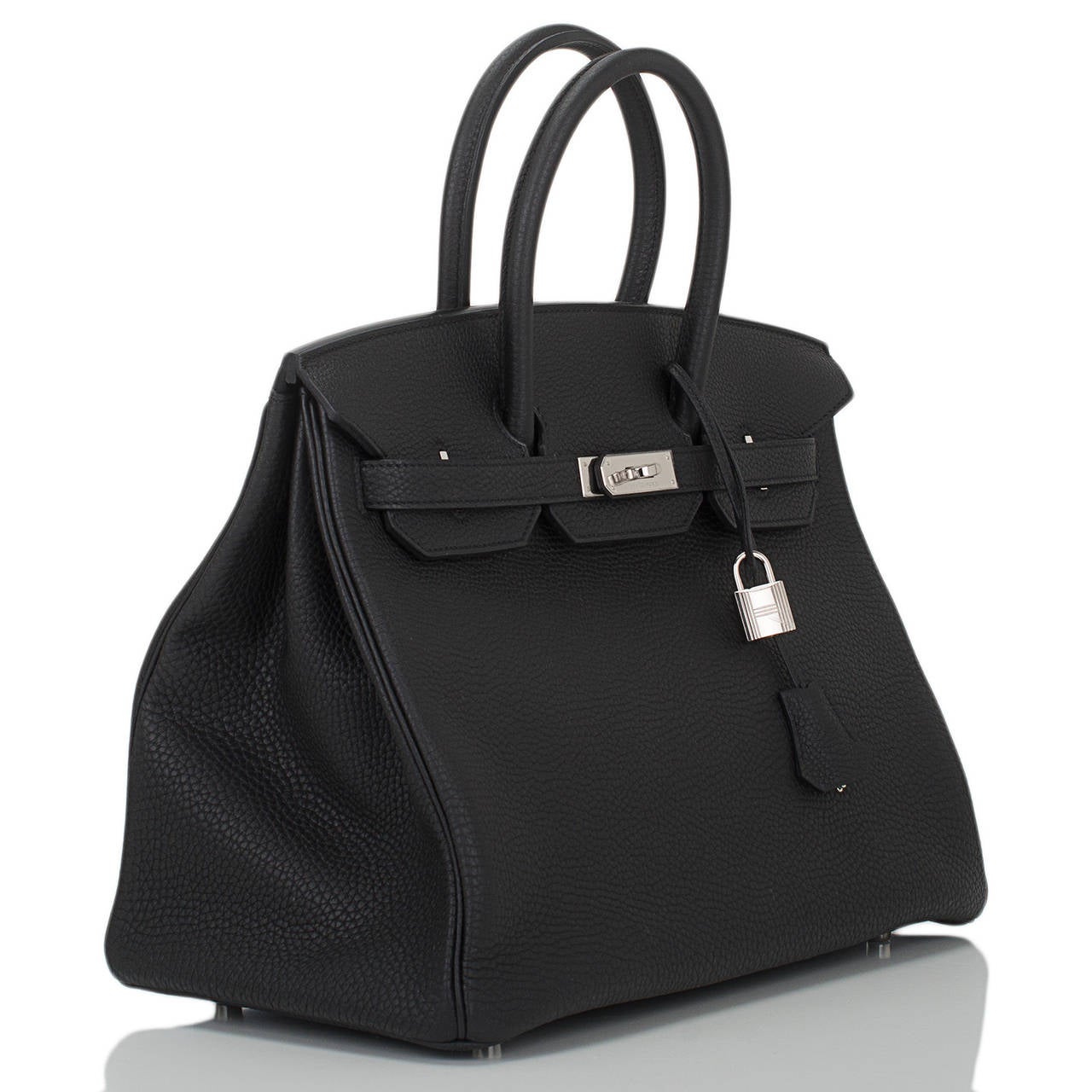 Hermes black Birkin 35cm in togo (bull) leather with palladium hardware.

The Hermes Birkin is the most coveted and the hardest to secure handbag in the world. Immediately recognizable by its shape, its thin straps with metal plates on end of each