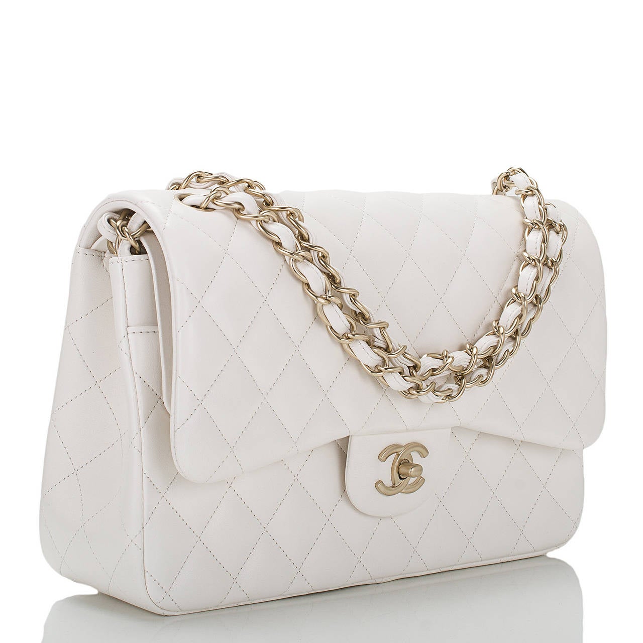 This limited edition Chanel Jumbo Classic double flap of white quilted lambskin leather and matte gold hardware features a front flap with signature CC turnlock closure, half moon back pocket, and an adjustable interwoven matte gold tone chain link