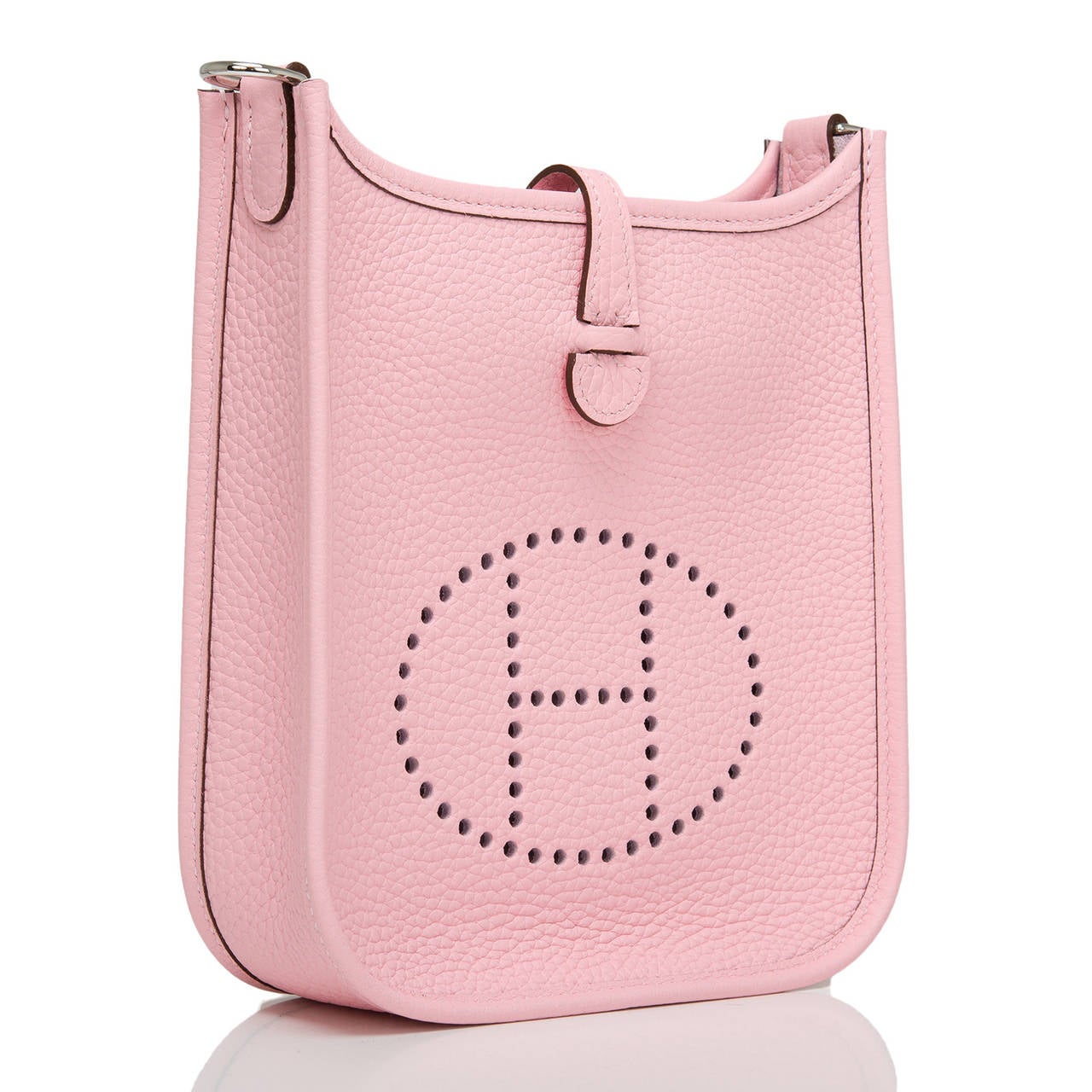 Hermes Rose Sakura Evelyne TPM in clemence leather with palladium hardware.

This Evelyne III is made in a beautiful new Hermes pink-- Rose Sakura -- in rich textured clemence leather and has palladium hardware, tonal stitching, large perforated H