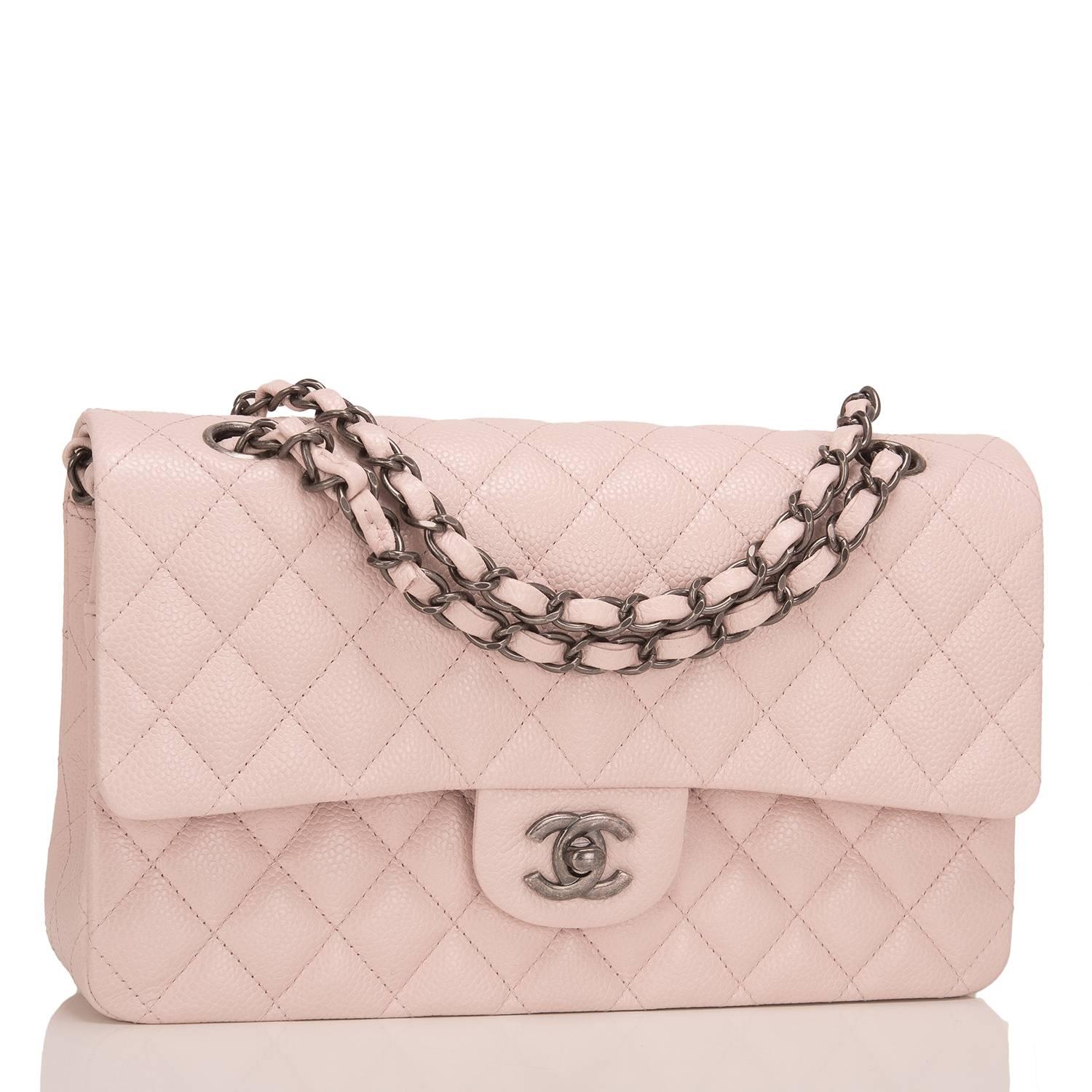 Chanel light pink Medium Classic Double Flap bag of quilted caviar leather accented with aged ruthenium hardware.

The bag features a front flap with signature CC turnlock closure, half moon back pocket and adjustable interwoven aged ruthenium