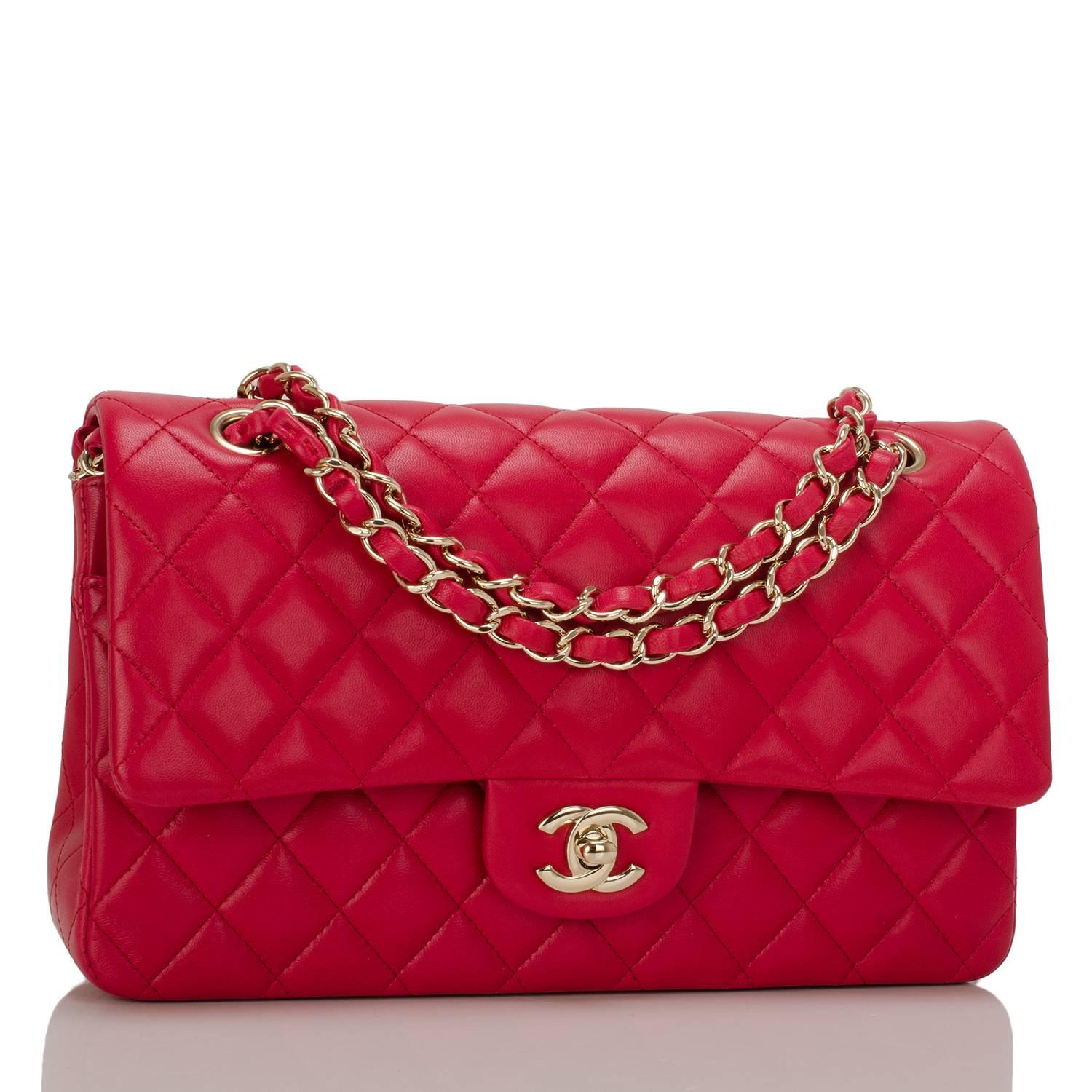 This Chanel red medium Classic Double Flap bag is made of quilted lambskin leather and accented with light gold tone hardware.

The bag features a full front flap with signature CC turnlock closure, a half moon back pocket and an adjustable