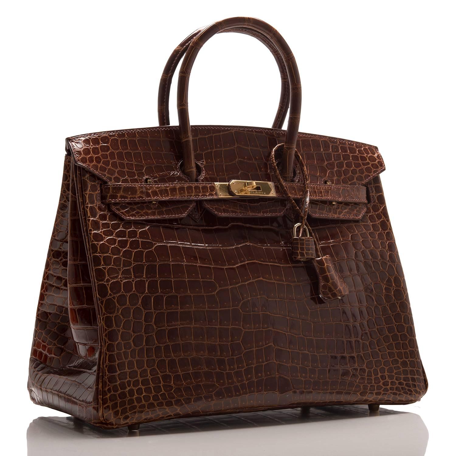 Hermes Cognac Birkin 35cm in shiny porosus crocodile leather with gold hardware.

This Birkin features tonal stitching, front toggle closure, clochette with lock and two keys, and double rolled handles.

The interior is lined in Cognac chevre