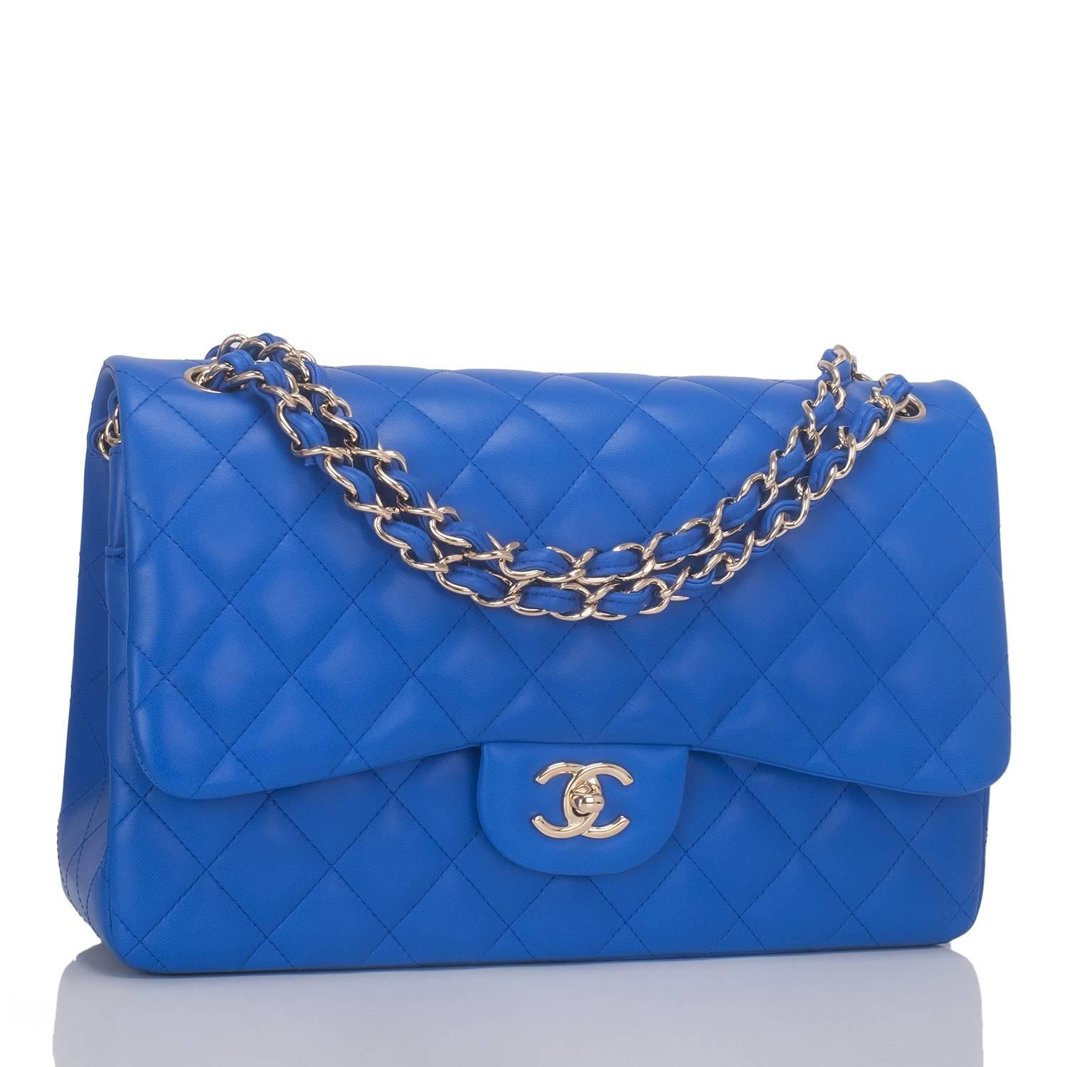 Chanel Jumbo Classic double flap bag of blue lambskin leather and light gold tone hardware.

This bag features a front flap with signature CC turnlock closure, a half moon back pocket, and an adjustable interwoven chain link with blue lambskin
