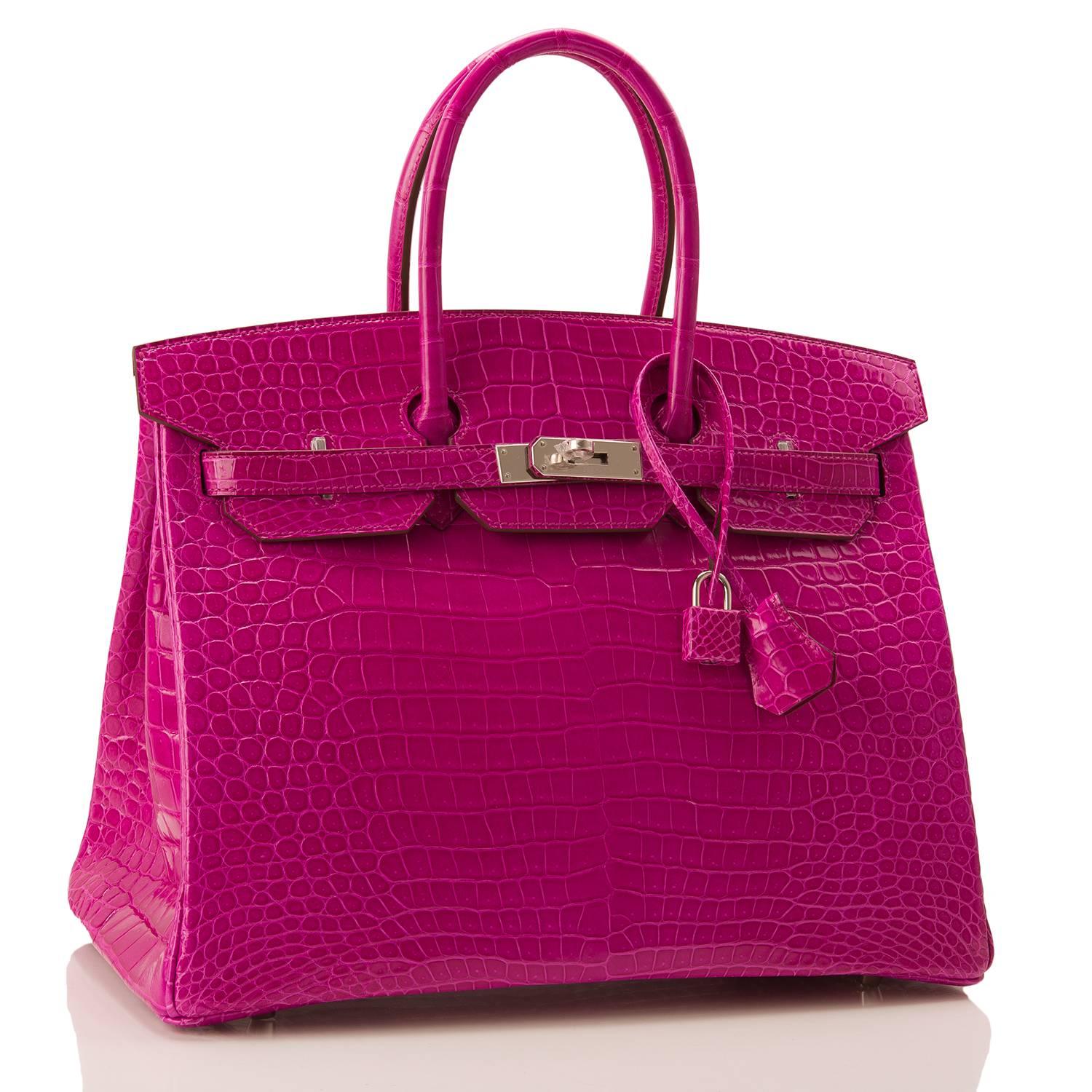 Hermes Rose Scheherazade Birkin 35cm in shiny porosus crocodile leather with palladium hardware.

This exotic Birkin features tonal stitching, front toggle closure, clochette with lock and two keys, and double rolled handles.

The interior is