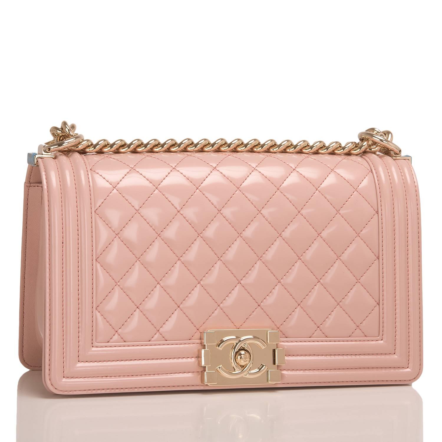 Chanel Medium Boy bag of light pink iridescent calfskin leather with light gold tone hardware.

This bag features a full front flap with the Le Boy CC push lock closure and a light gold tone chain link and light pink leather padded