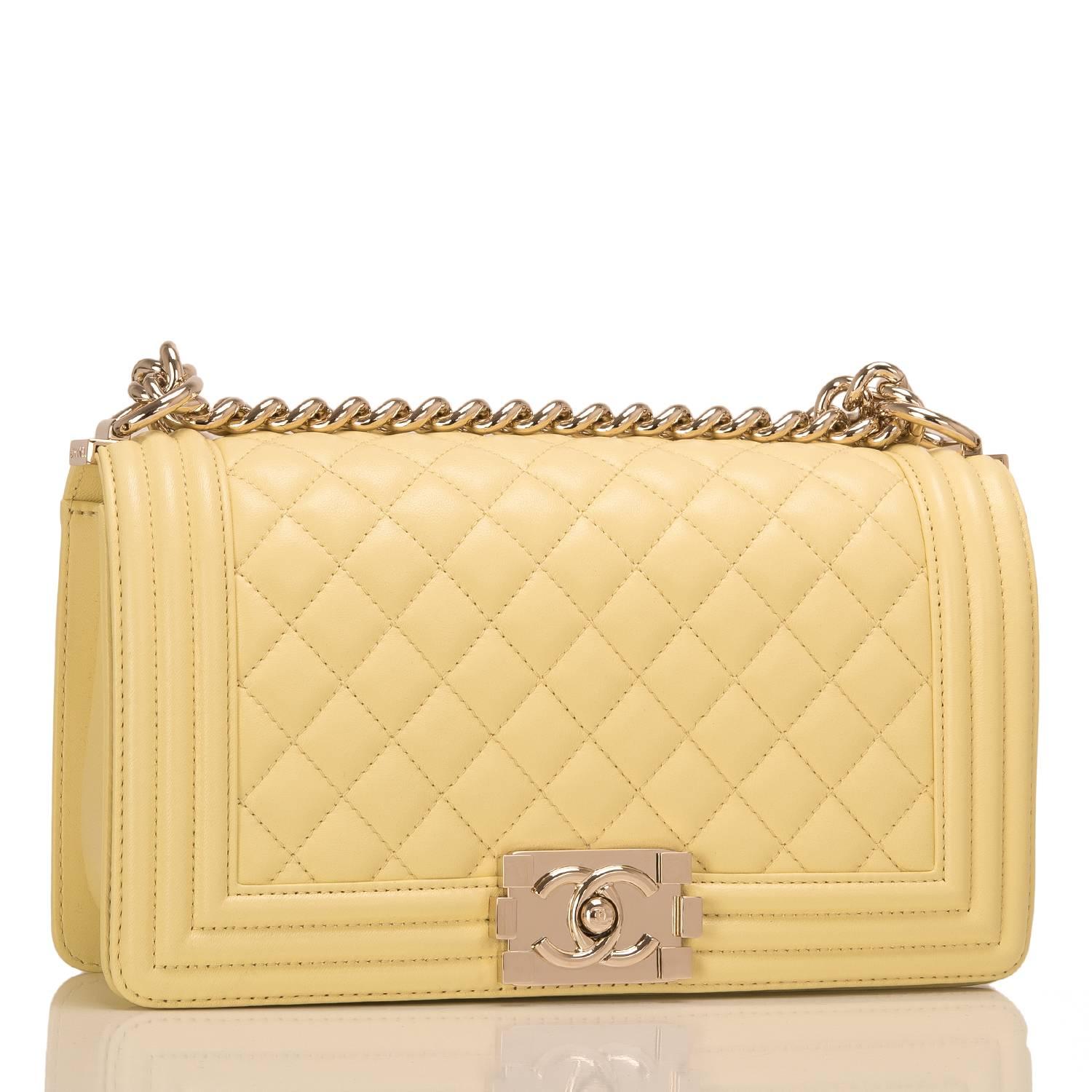Chanel Medium Boy bag of yellow lambskin leather with light gold tone hardware.

This bag features a full front flap with the Le Boy CC push lock closure and a light gold tone chain link and yellow leather padded shoulder/crossbody strap.

The