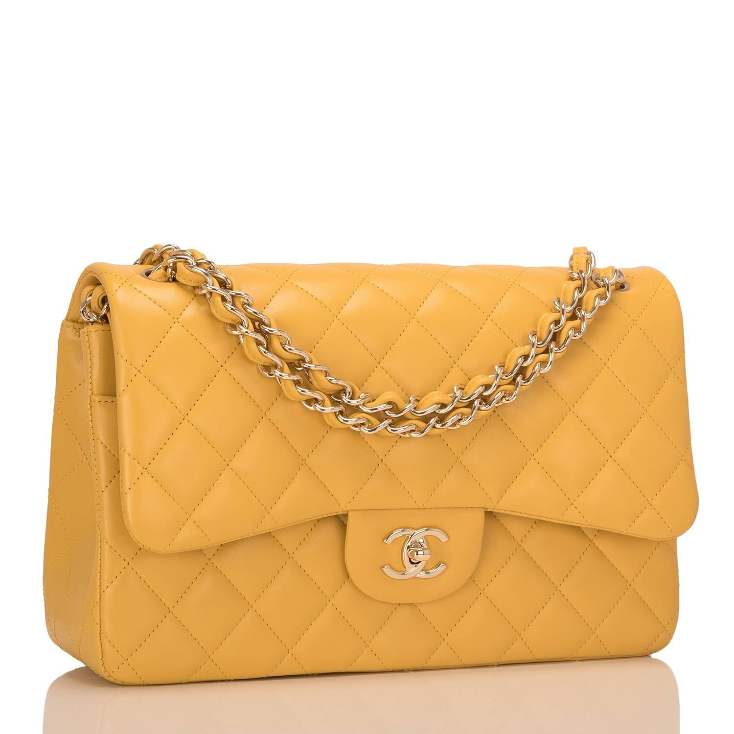 Chanel Jumbo Classic double flap bag of yellow lambskin leather and light gold tone hardware.

This bag features a front flap with signature CC turnlock closure, a half moon back pocket, and an adjustable interwoven chain link with yellow lambskin
