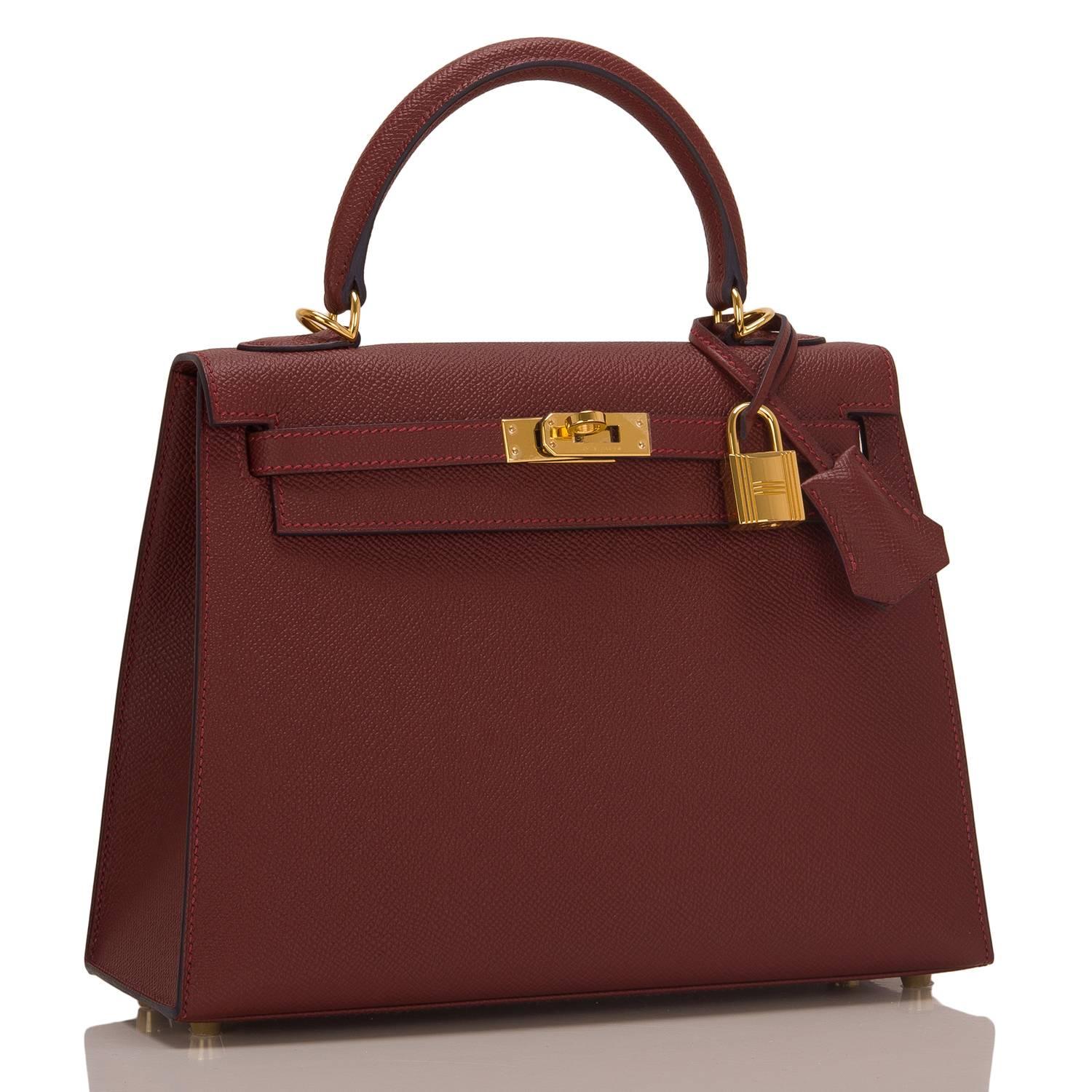 Hermes Rouge H Sellier Kelly 25cm of epsom leather with indigo blue contour and gold hardware.

This limited edition Sellier Kelly has indigo contour (resin), tonal stitching, front toggle closure, a clochette with lock and two keys, single rolled