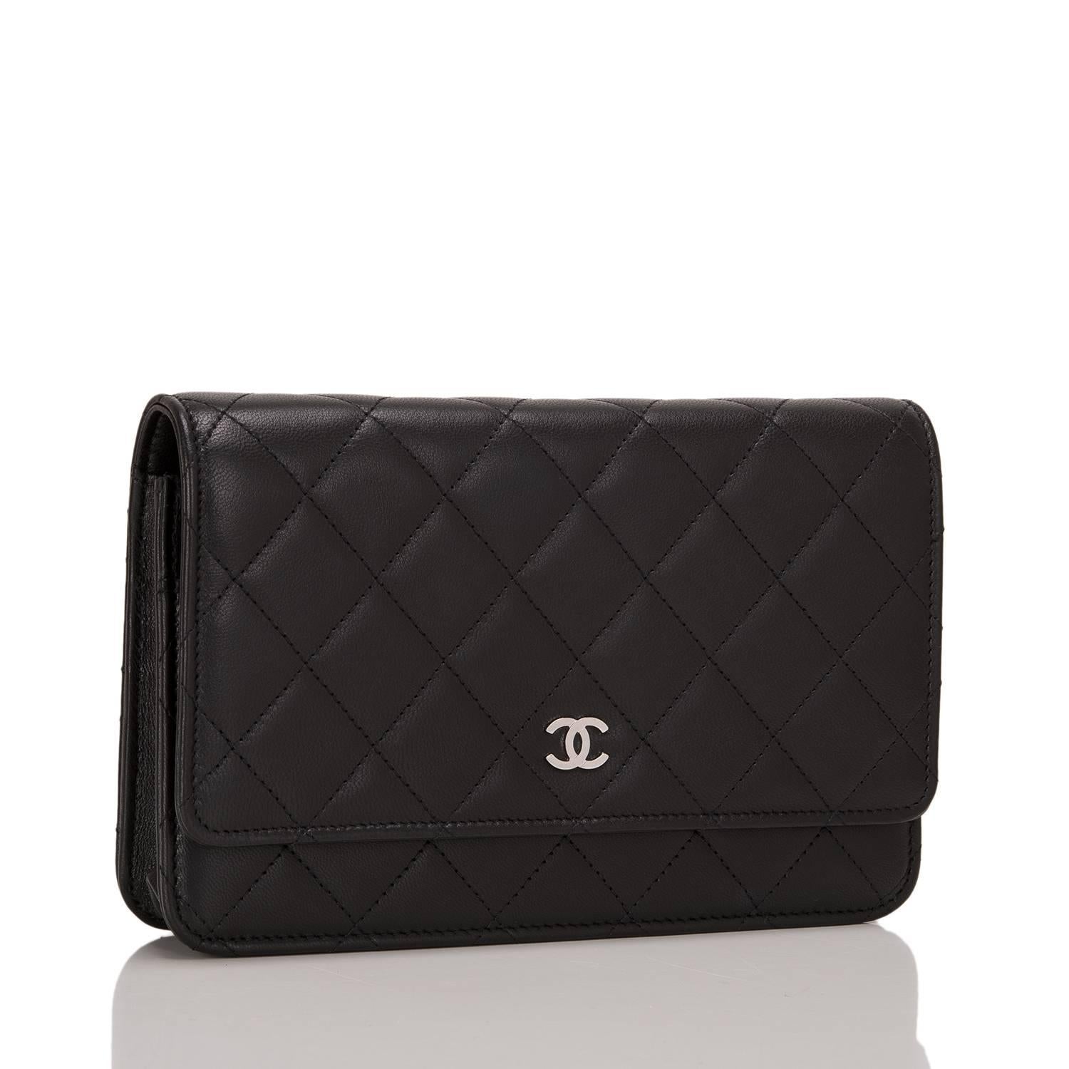Chanel Classic Wallet On Chain (WOC) of black calfskin leather with silver tone hardware.

This Wallet On Chain features signature Chanel quilting, a front flap with CC charm and hidden snap closure, a half moon pocket at the rear and an