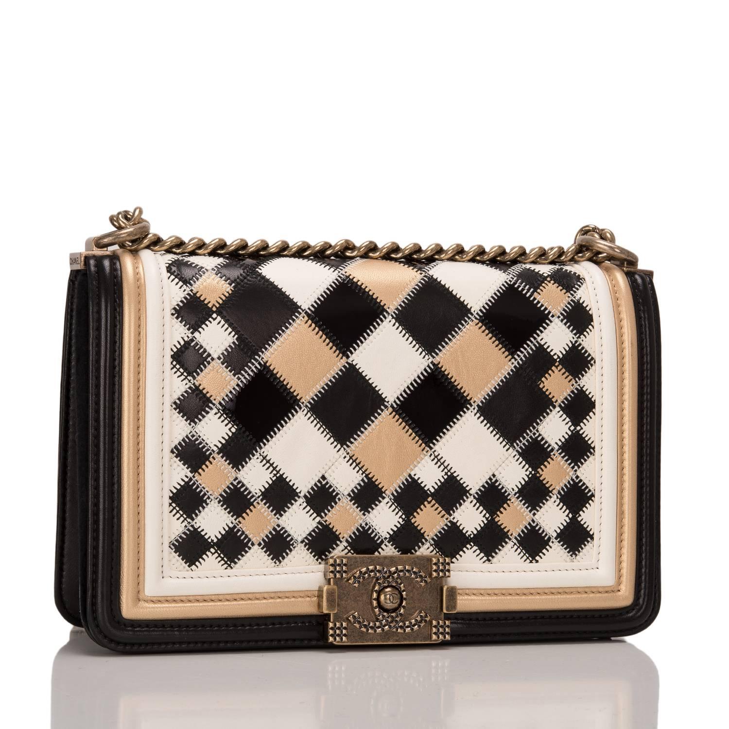Chanel Metiers d'Art "Hall Of Mirrors" Medium Boy bag of black, white, and metallic gold lambskin leather with antique brass hardware.

This rare, collectible bag from the famed Versailles collection features a full front flap with