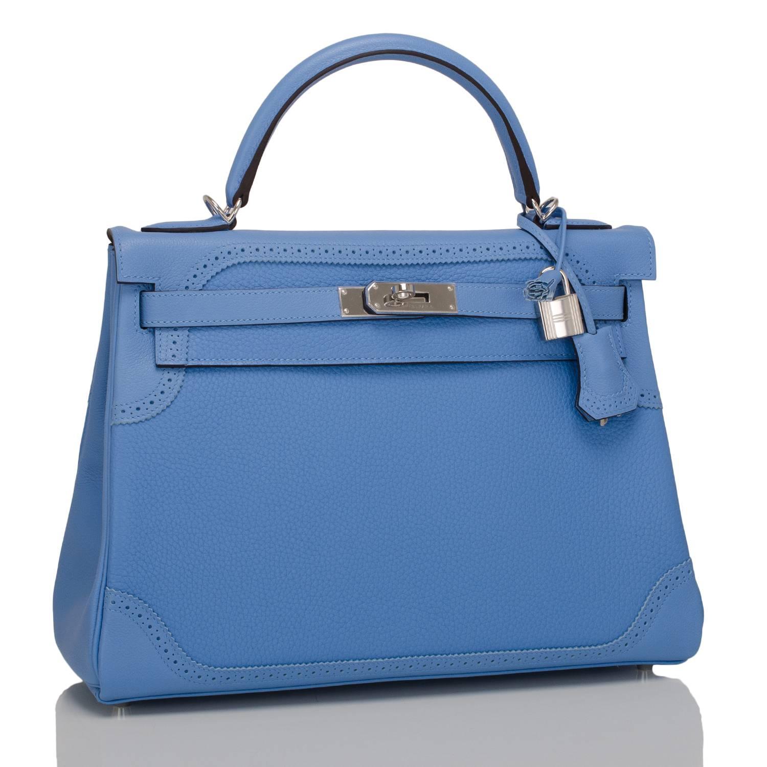 Hermes Blue Paradise Ghillies Kelly 32cm of clemence leather with palladium hardware.

This Kelly has a broguing and serration sinuous pattern at top and bottom, tonal stitching, a front toggle closure, a clochette with lock and two keys, and