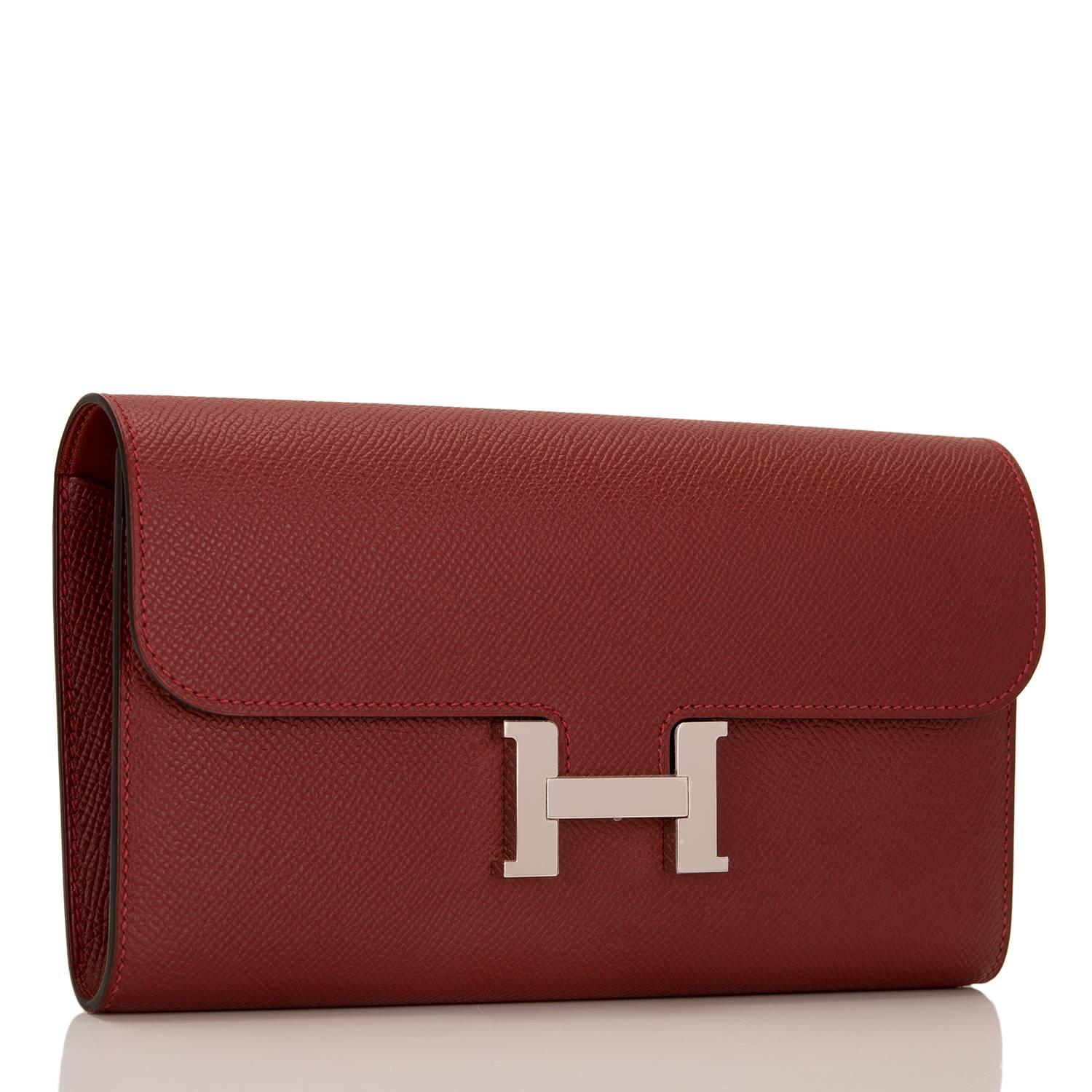 Hermes Rouge H Constance Long Wallet of epsom leather with palladium hardware.

This Wallet features tonal stitching, a metal "H" snap lock closure and a rear exterior pocket.

The interior is lined with Rouge H epsom leather and has