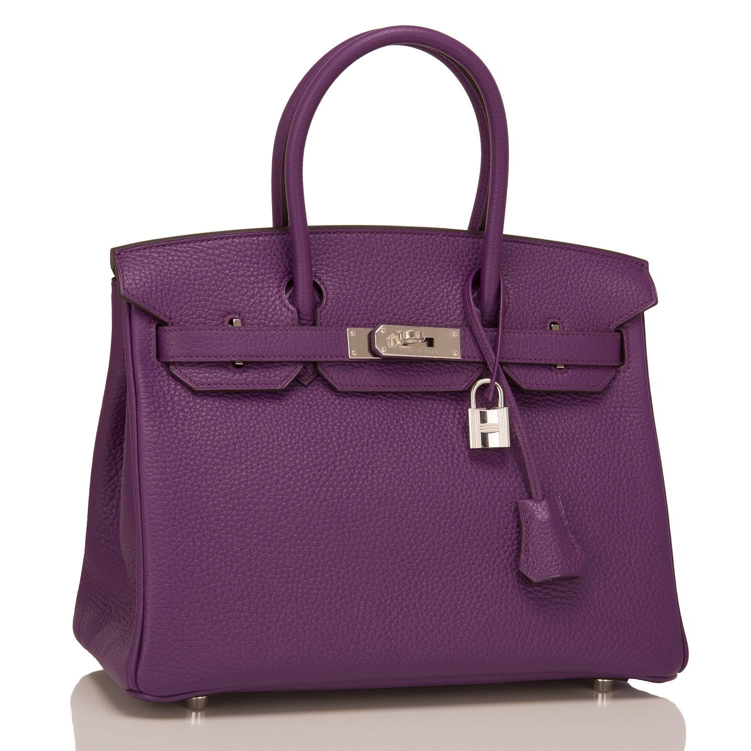 Hermes Ultraviolet Birkin 30cm of togo leather with palladium hardware.

This Birkin has tonal stitching, a front toggle closure, a clochette with lock and two keys, and double rolled handles.

The interior is lined with Ultraviolet chevre and