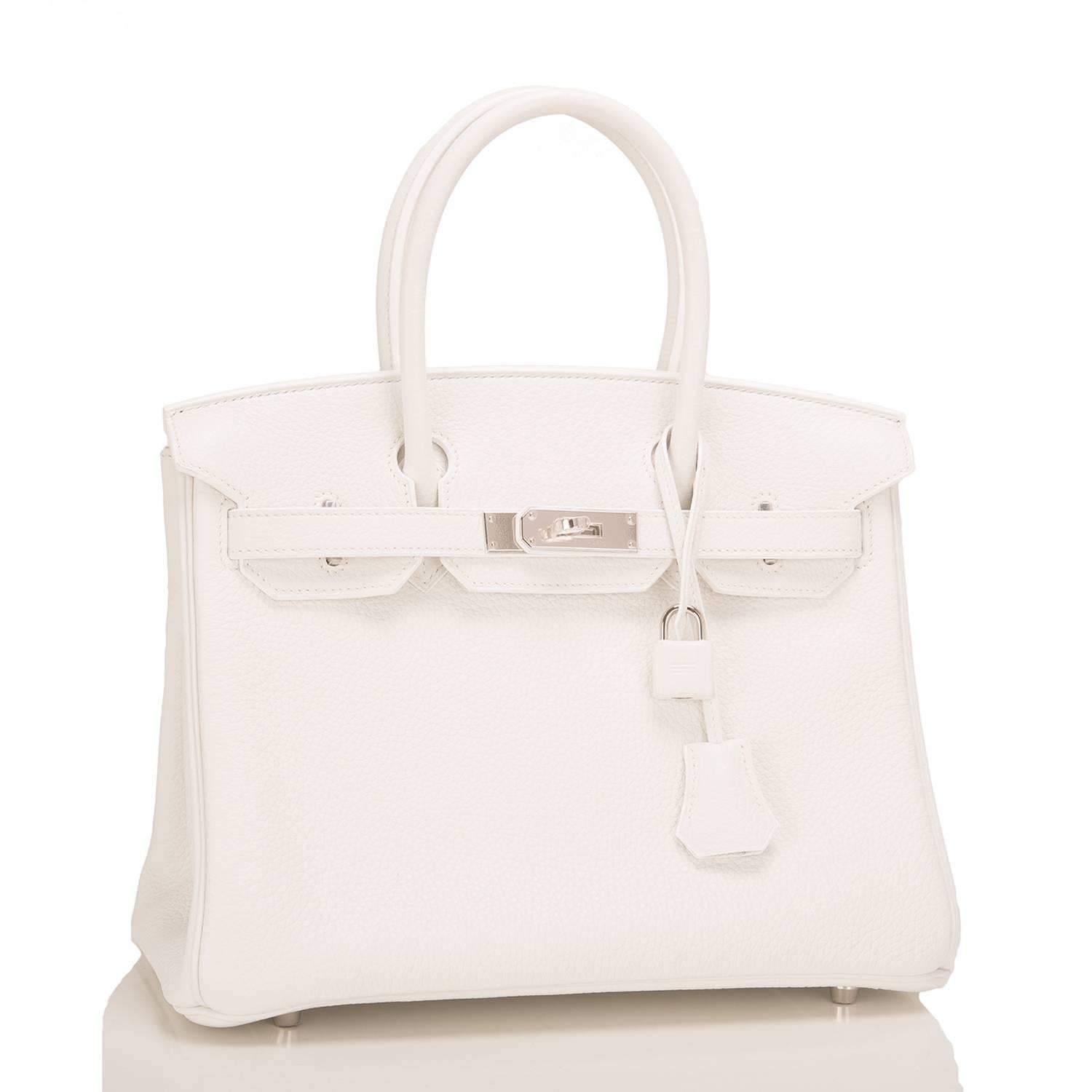 Hermes white Birkin 30cm of clemence leather with palladium hardware.

This Birkin has tonal stitching, a front toggle closure, a clochette with lock and two keys, and double rolled handles.

The interior is lined with white chevre and has a zip
