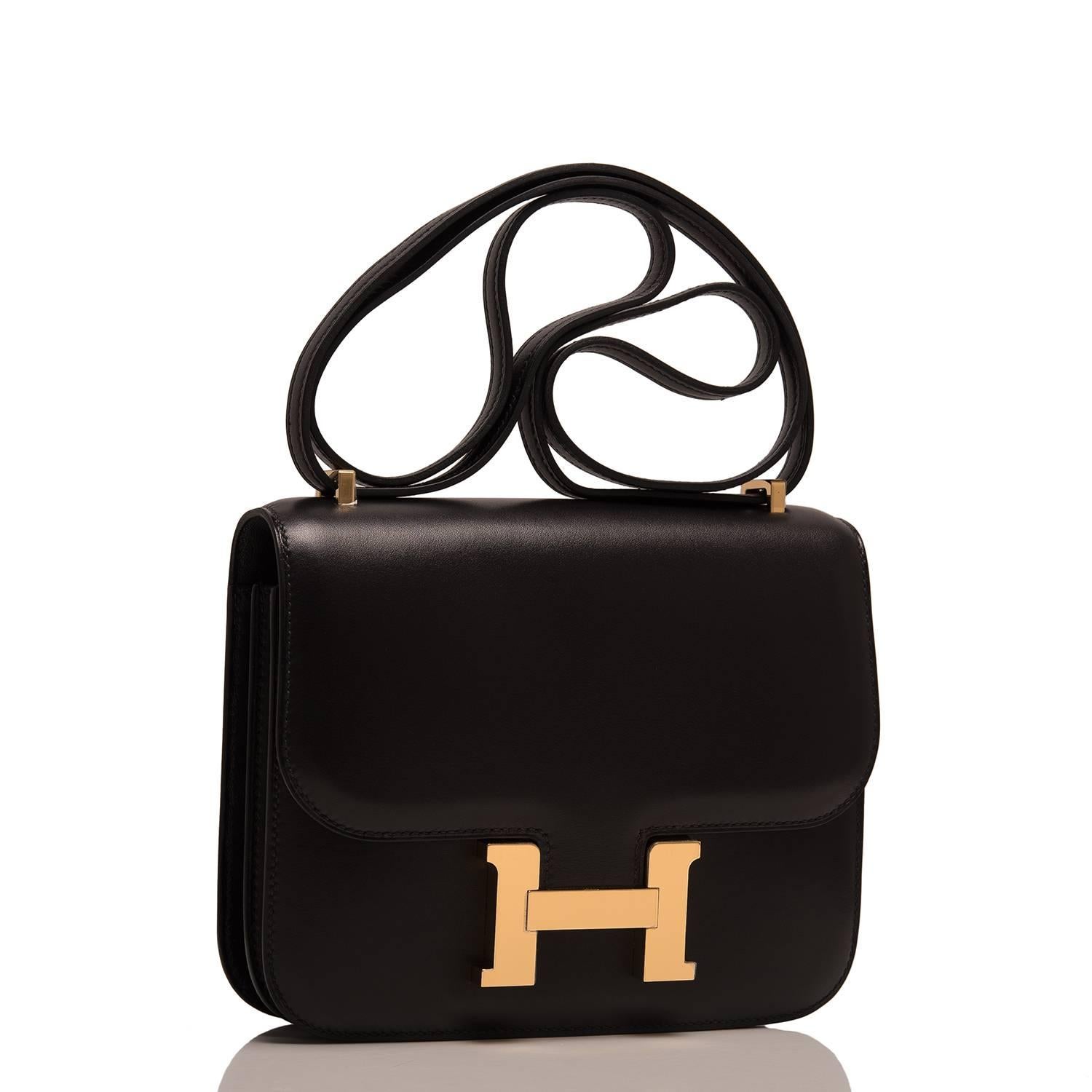 Hermes black Mini Constance 18cm of evercalf leather with gold hardware.

This Constance has tonal stitching, a metal