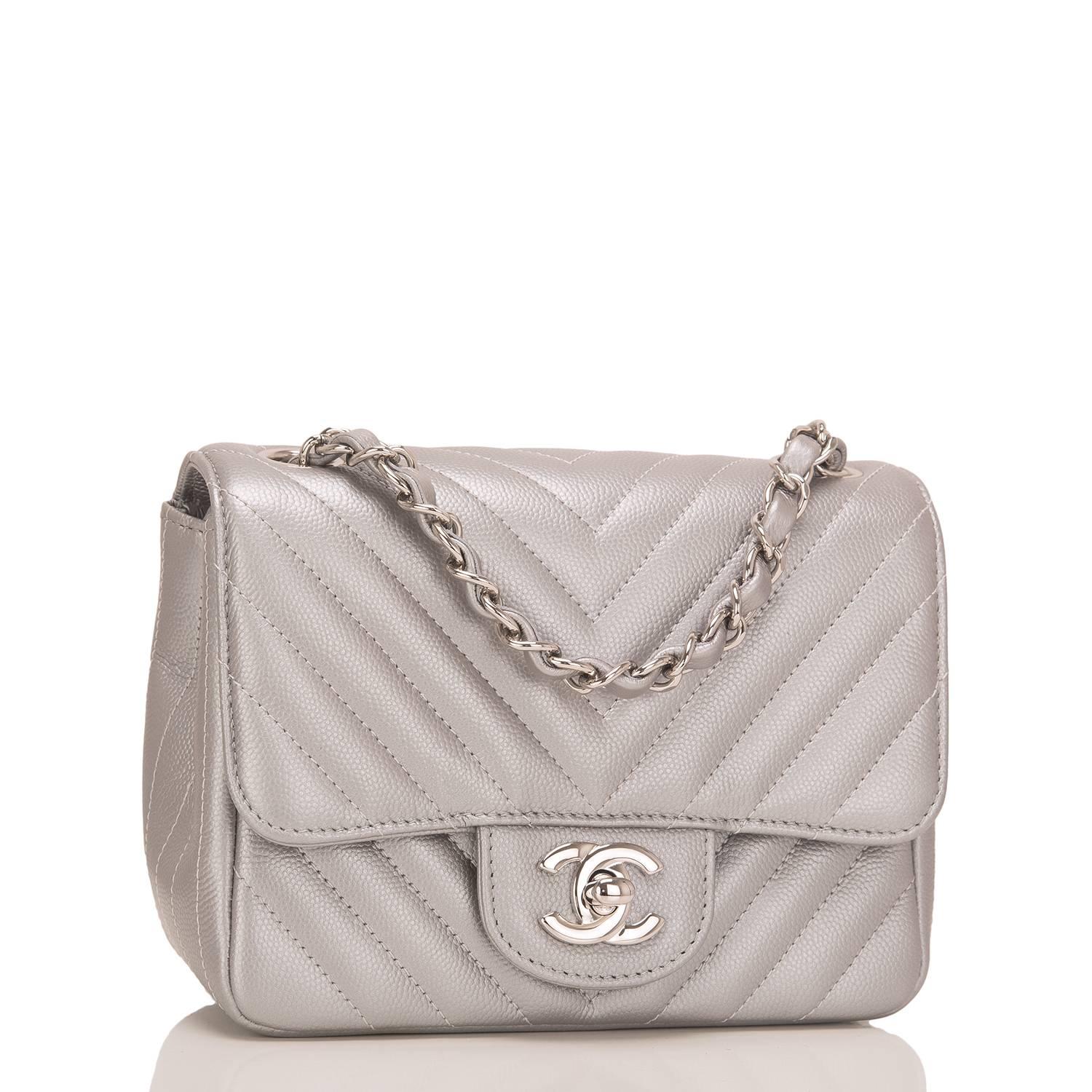 Chanel silver chevron quilted square Mini flap bag of silver caviar leather with silver tone hardware.

This bag features a front flap with CC turnlock closure, a half moon back pocket, and an interwoven silver tone chain link with silver leather