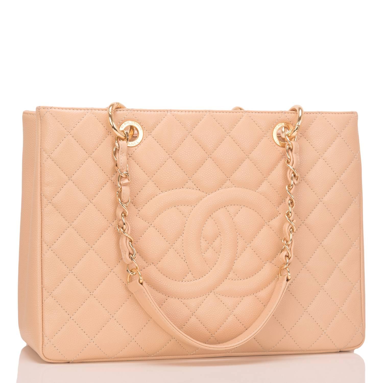 Chanel Grand Shopping Tote of light beige caviar leather with gold tone hardware.

This bag features front and rear quilting, a front stitched 