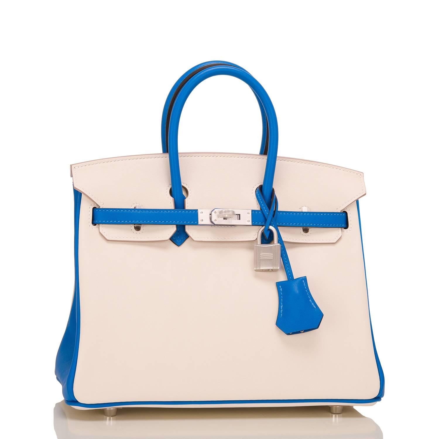 Hermes Horseshoe Stamp (HSS) Birkin 25cm of blue hydra and craie swift leather with brushed palladium hardware.

This Special Order Birkin has tonal stitching, a front toggle closure, a clochette with lock and two keys, and double rolled