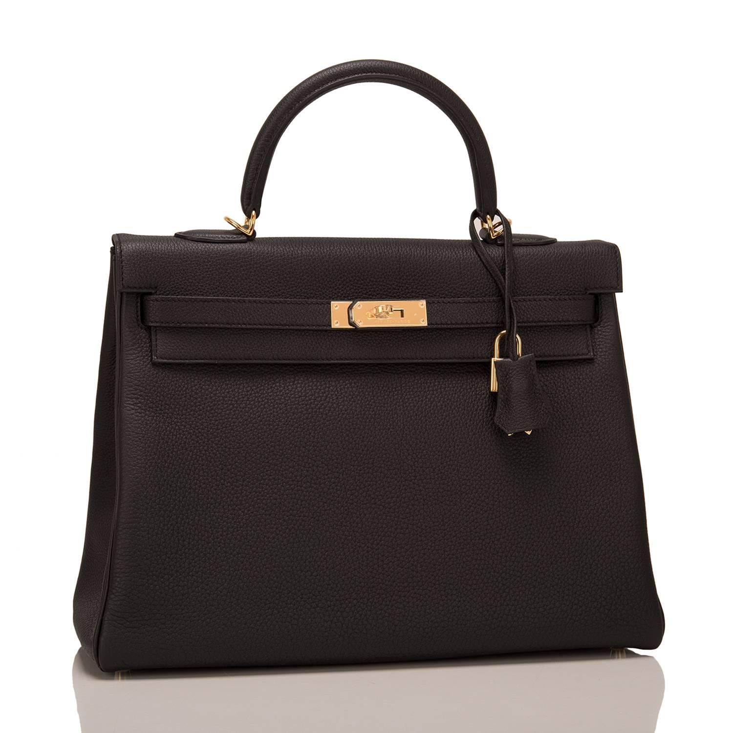 Hermes Black Kelly 35cm of togo leather with gold hardware.

This Kelly, in the Retourne style, has tonal stitching, a front toggle closure, a clochette with lock and two keys, a single rolled handle, and a removable shoulder strap.

The