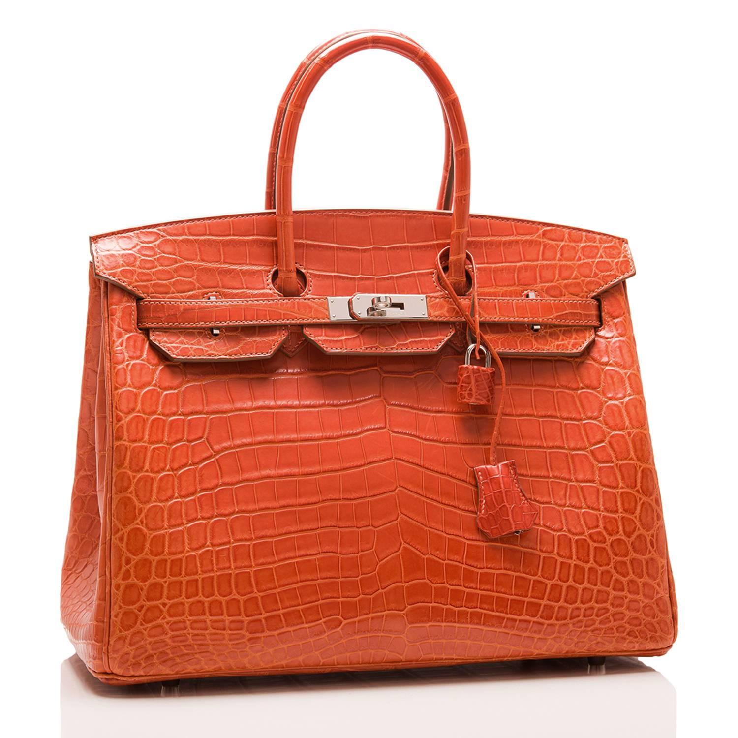 Hermes Sanguine Birkin 35cm of matte niloticus crocodile leather with palladium hardware.

This Birkin features tonal stitching, a front toggle closure, a clochette with lock and two keys, and double rolled handles.

The interior is lined with