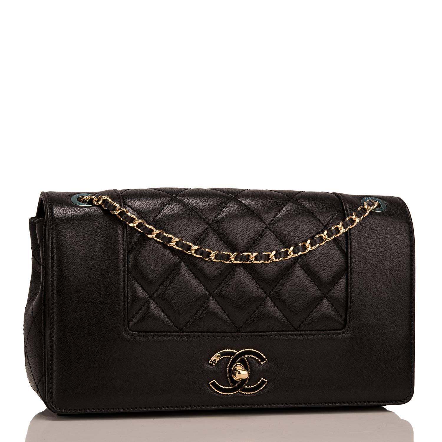 Chanel Paris In Rome Metiers d'Art Flap Bag of black sheepskin leather with gold tone hardware.

This limited edition bag features black quilting wth smooth leather time, a front flap with black enamel and gold tone turnlock closure, an interior
