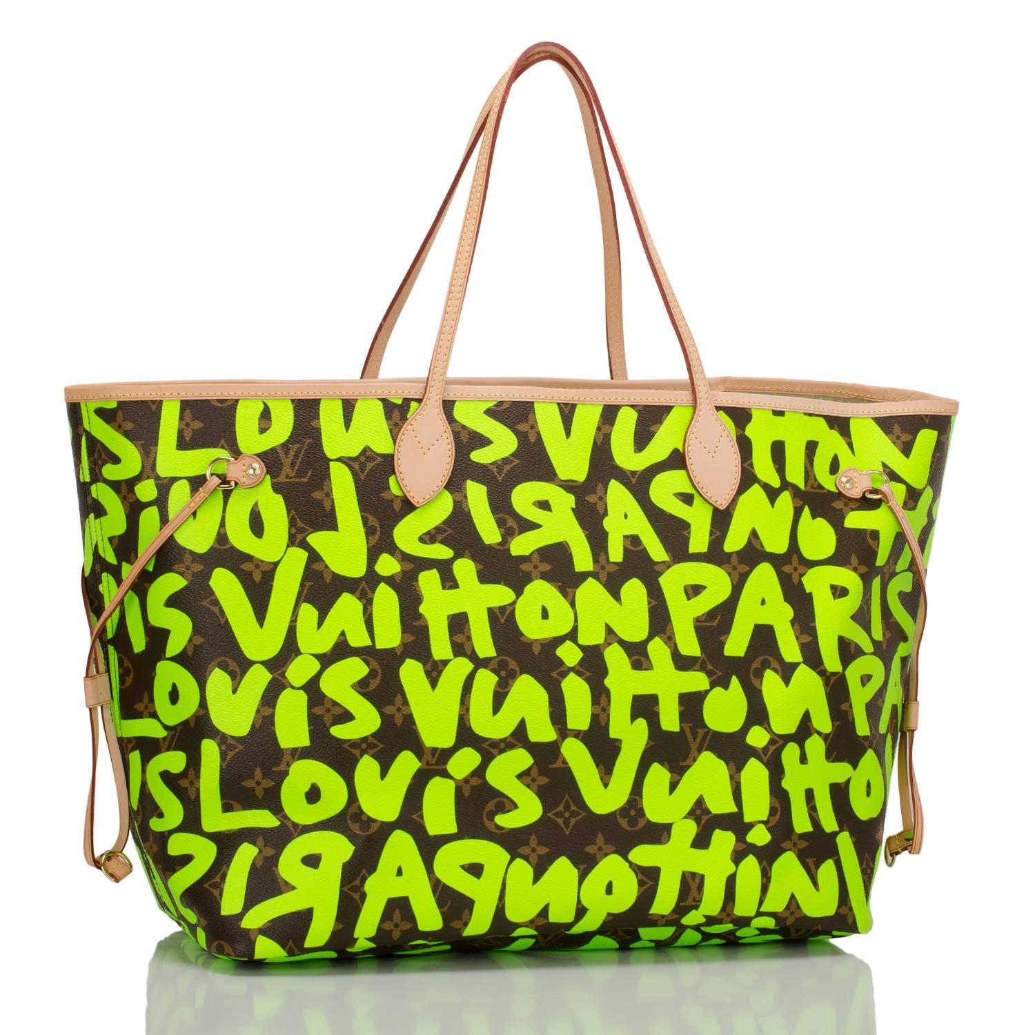 Louis Vuitton Green Monogram Graffiti Neverfull GM of coated canvas with silk screened bright fluorescent green colored graffiti lettering designed in tribute to Stephen Sprouse.

This classic tote features polished brass hardware, vachetta