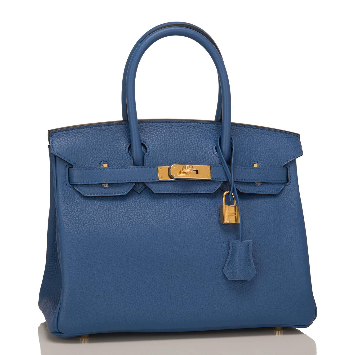 Hermes Bleu Agate Birkin 30cm of Clemence leather with gold hardware.

This Birkin has tonal stitching, a front toggle closure, a clochette with lock and two keys, and double rolled handles.

The interior is lined with Blue Agate chevre and has