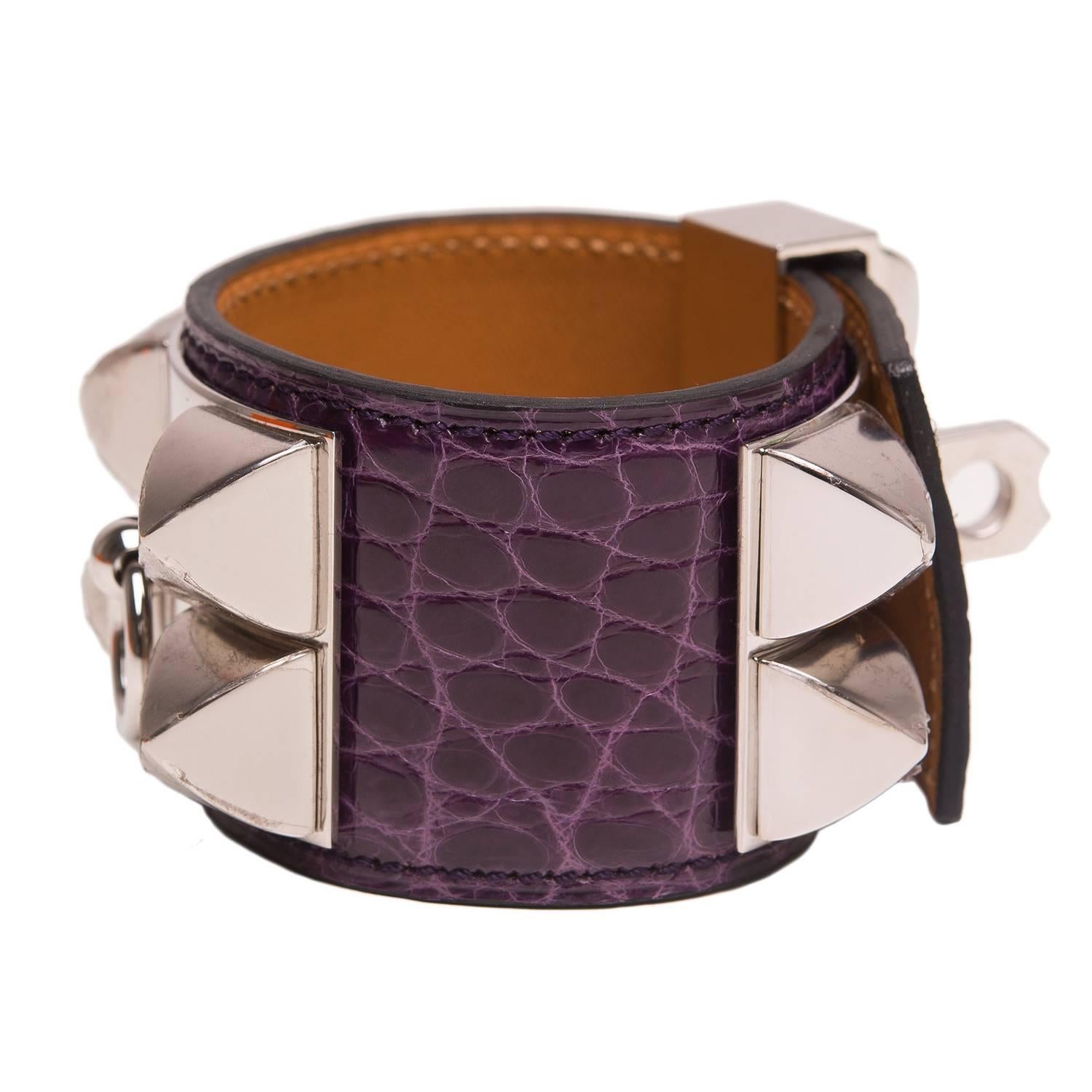 Hermes Collier de Chien (CDC) in Amethyst shiny alligator with palladium plated hardware in size small.

This style features palladium pyramid studs, center ring and adjustable push lock closure.

Collection: P square

Origin: