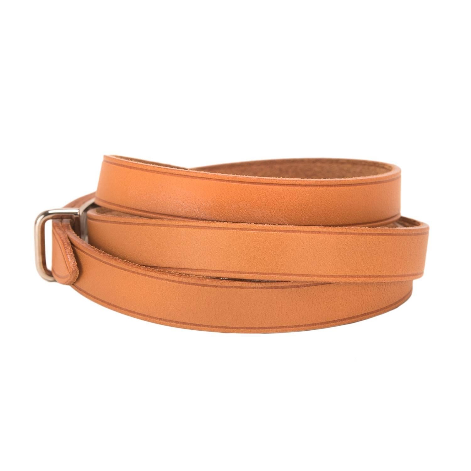Hermes Brown calfskin leather quadruple wrap bracelet.

It has silver and palladium plated hardware.

Origin: France

Condition: Pristine, never worn

Accompanied by: Hermes box

Measurements: Length (total): 28.25in; Width:  .375in