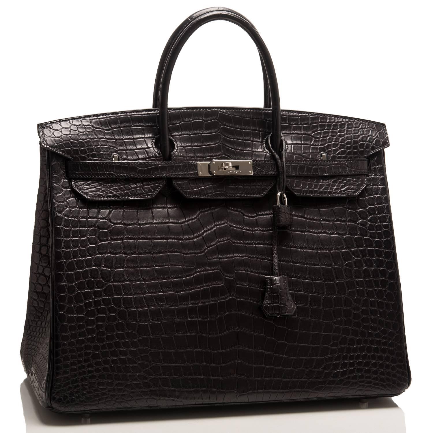 Hermes Black Birkin 40cm of matte porosus crocodile leather with palladium hardware.

This Birkin has tonal stitching, a front toggle closure, a clochette with lock and two keys, and double rolled handles.

The interior is lined with Black