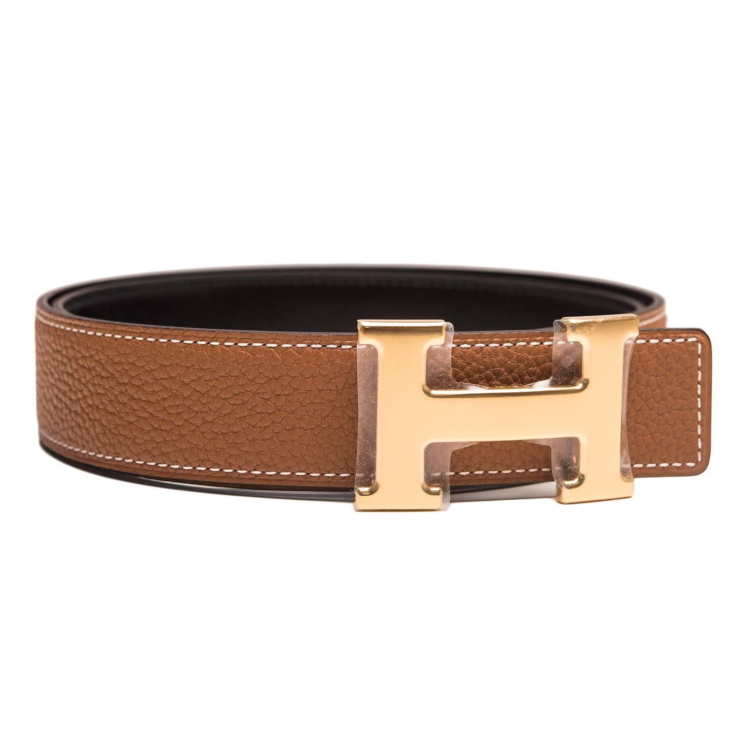 Hermes belt kit comprising an adjustable wide 32mm Constance H belt of Black calfskin with tonal stitching reversing to Gold epsom with tonal stitching accompanied by a removable gold plated H buckle.

Origin: France

Condition: Pristine, never