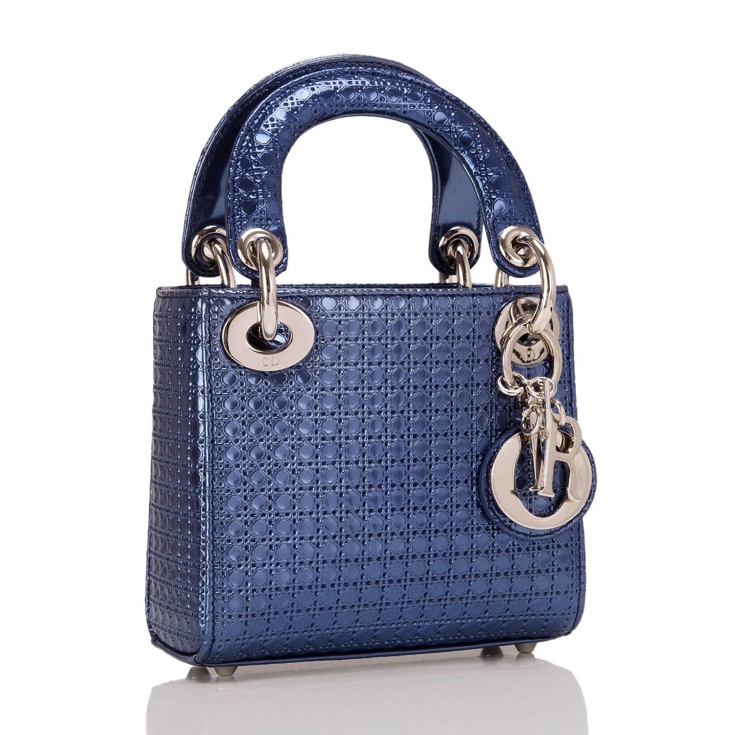 Dior Lady Dior Micro bag of blue metallic perforated calfskin and silver-tone hardware.

This Micro has a micro-cannage pattern all over, gusseted sides, four protective feet at bottom, top flap closure, double rounded flat handles, removable